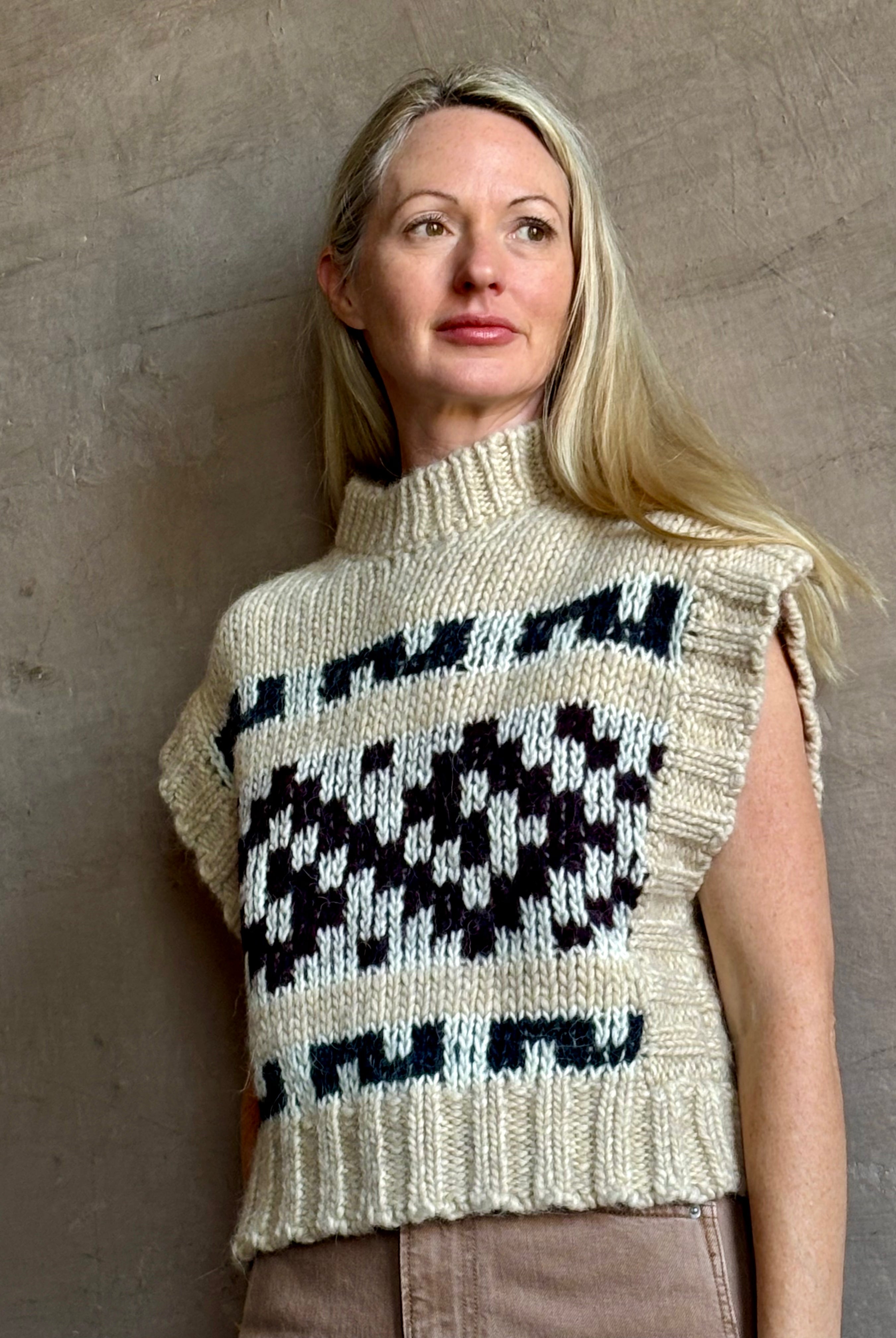 Image of mature woman wearing luxury Italian designer FORTE FORTE Attica Jacquard alpaca wool knit sweater Vest in Honey