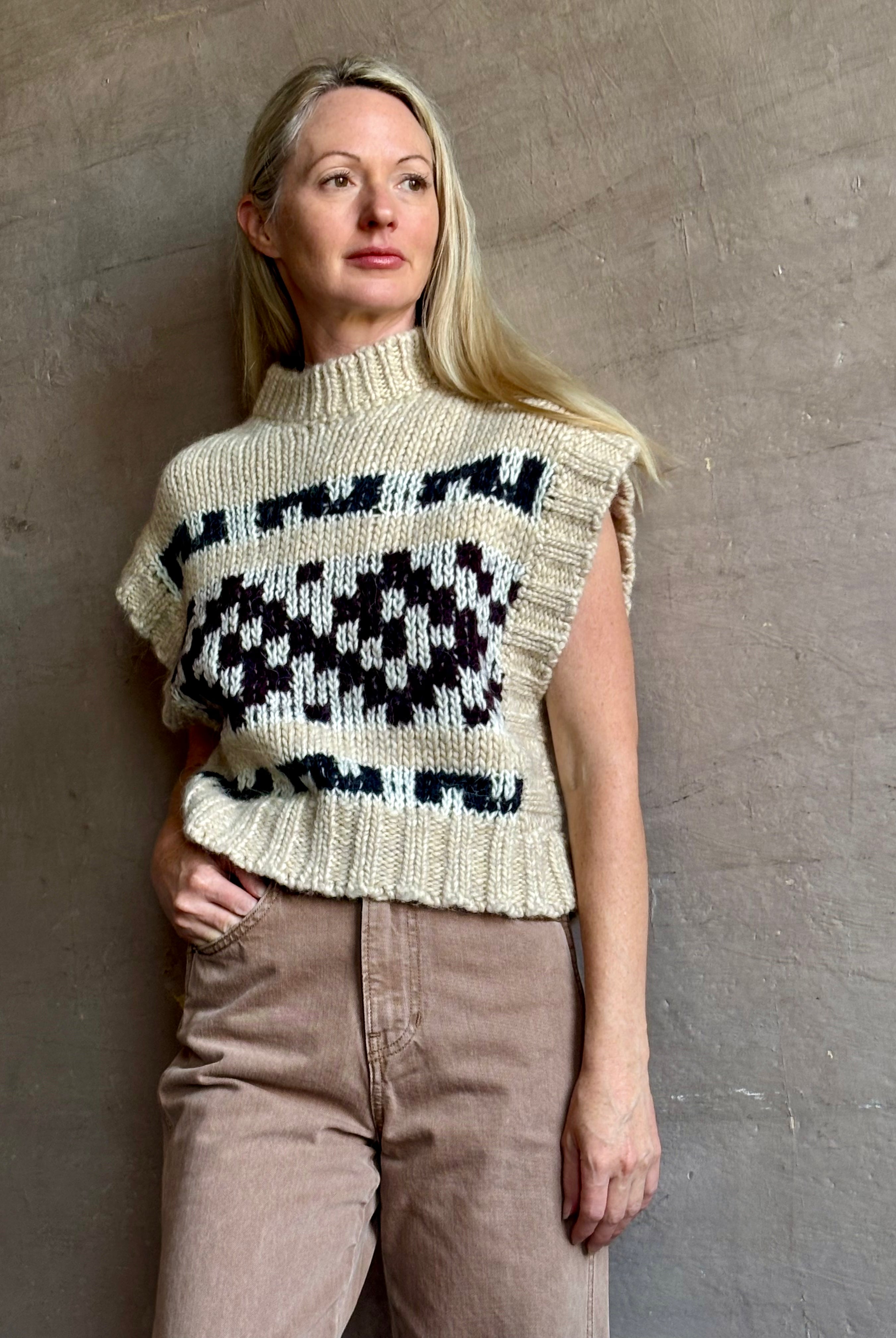 Image of mature woman wearing luxury Italian designer FORTE FORTE Attica Jacquard alpaca wool knit sweater Vest in Honey