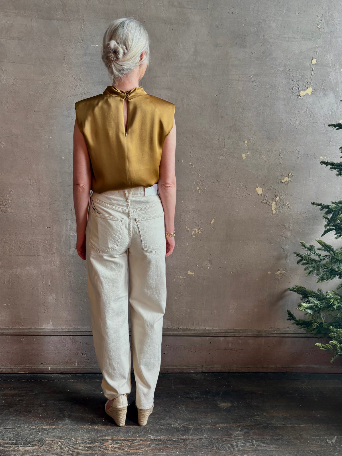 woman wearing luxury Italian designer FORTE FORTE Envers Satin Crater-Neck sleeveless Shirt matte Antique Gold