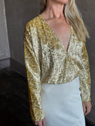 Image of mature woman wearing luxury Italian designer FORTE FORTE En Rêve Fil-Coup metallic velvet honey Shirt with V-neck and long sleeves