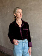 Image of mature woman wearing luxury Italian designer FORTE FORTE Velvet Button-Down Shirt in Bordeaux with Pajama-Inspired Boho Blouse