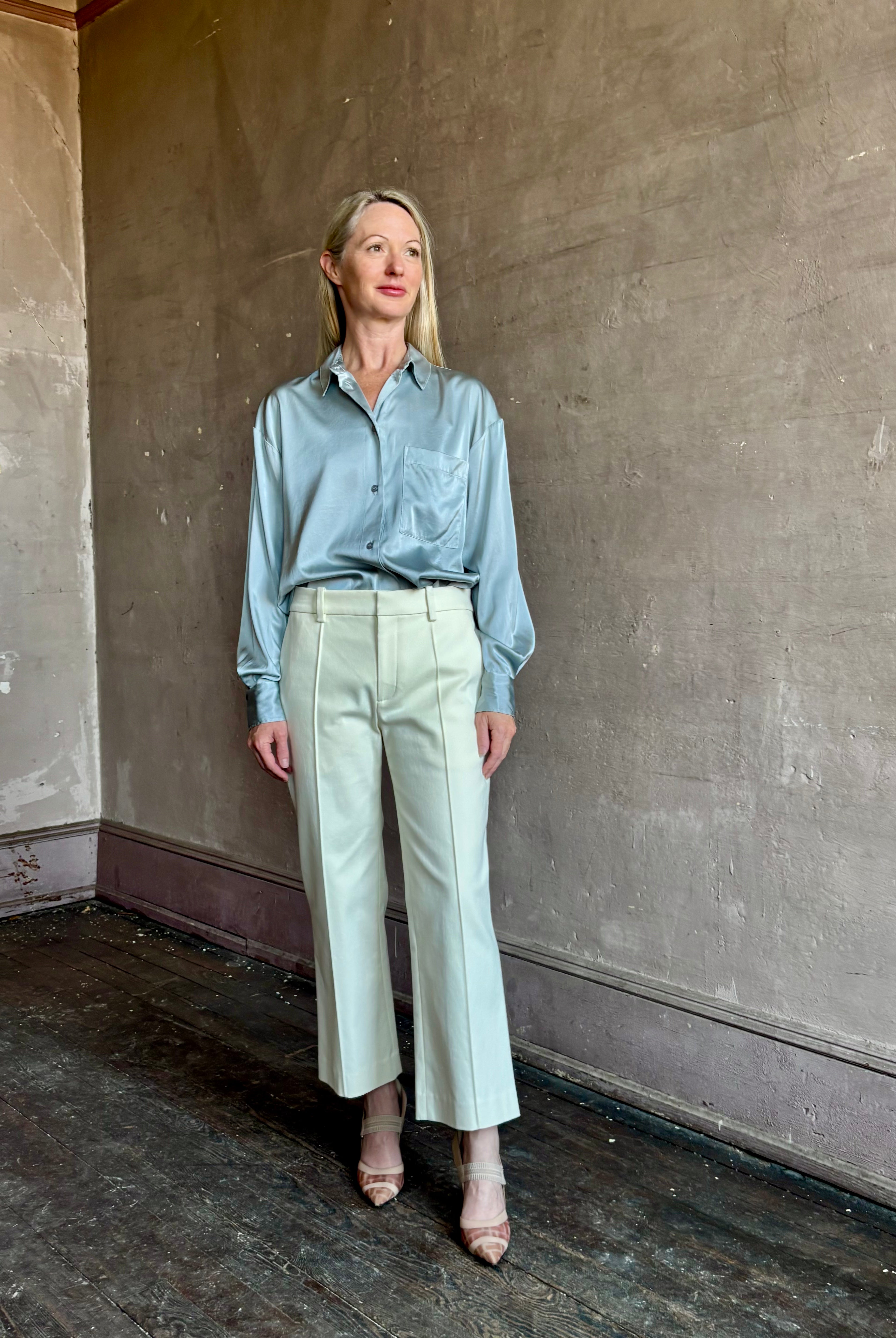 Image of mature woman wearing luxury Italian designer FORTE FORTE Stretch Silk Satin Cropped button down long sleeve Shirt in steel blue