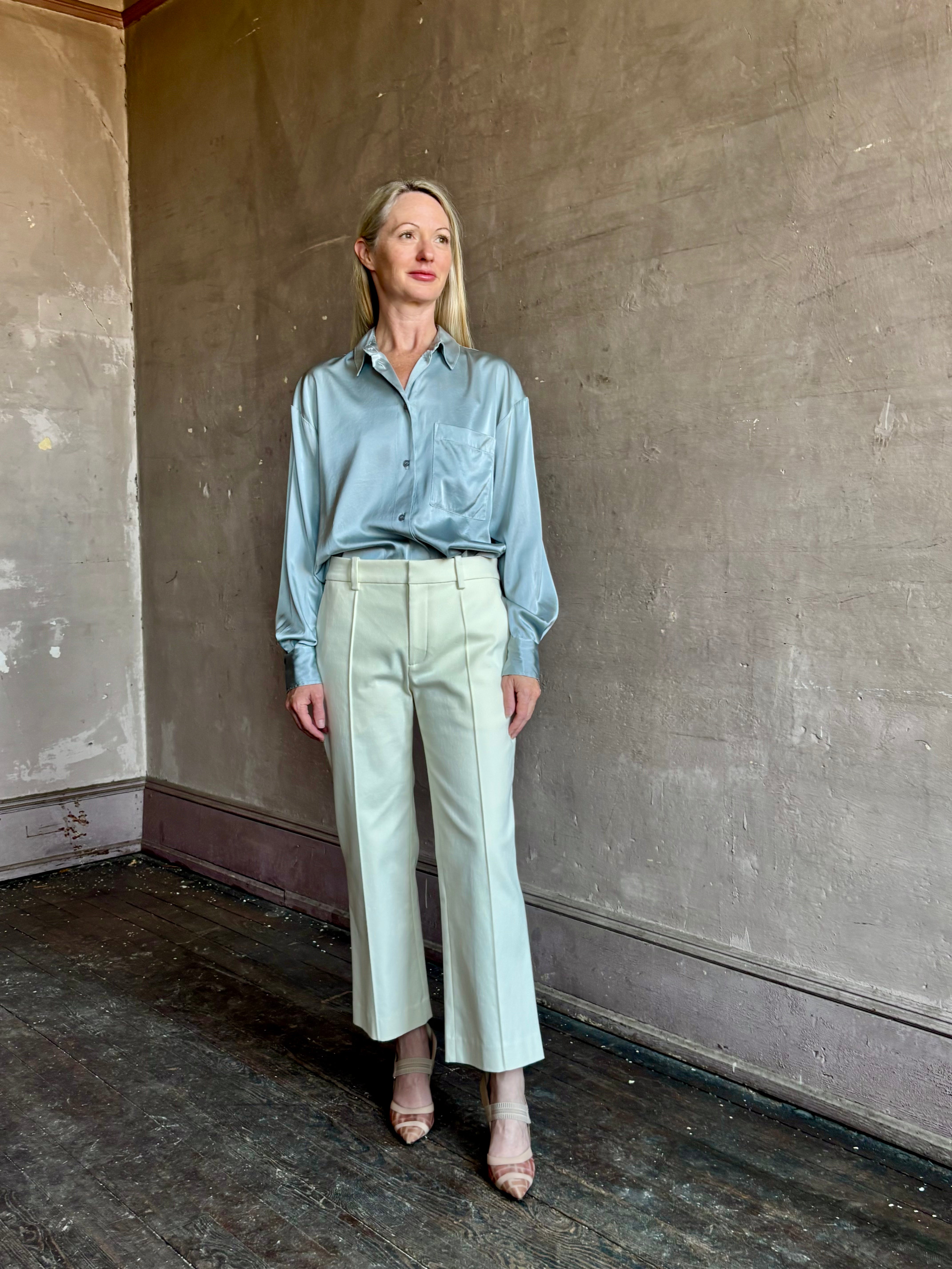 Image of mature woman wearing luxury Italian designer FORTE FORTE Stretch Silk Satin Cropped button down long sleeve Shirt in steel blue