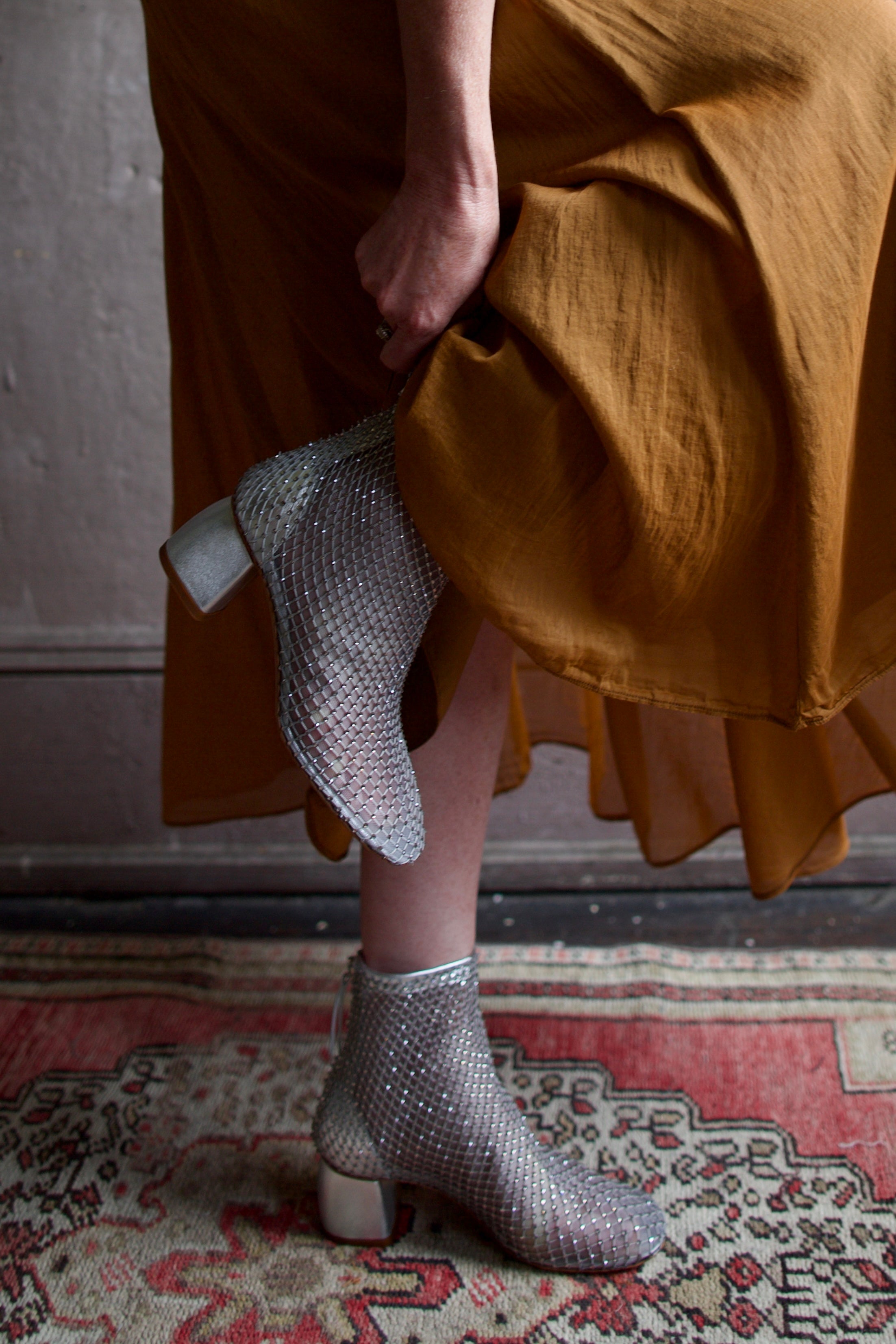 Model wearing luxury Italian designer Forte Forte mesh sheer silver ankle boot with elusive gleaming crystals.