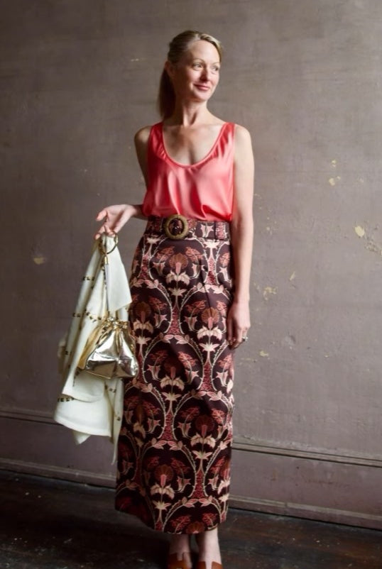 image of a woman wearing the Forte Forte tank and Cara Cara Printed Skirt
