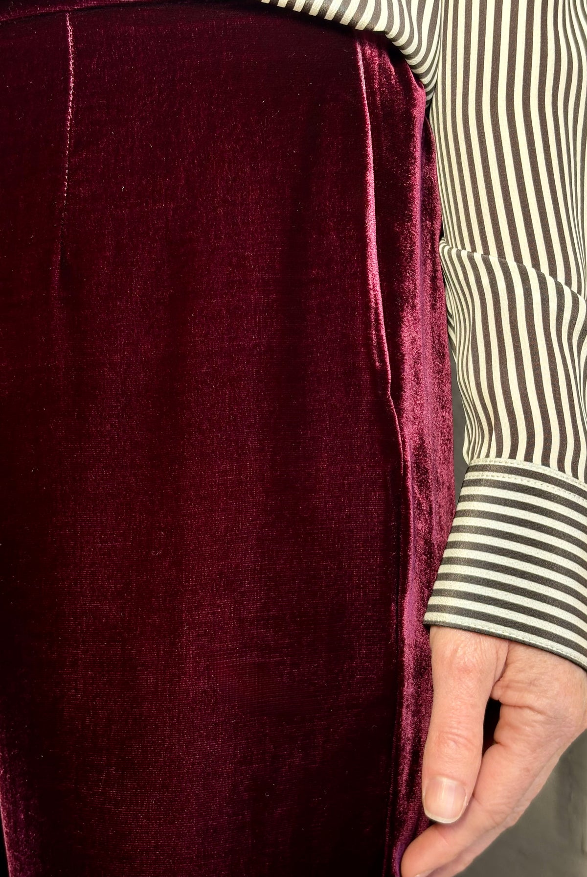 Close up of Forte_Forte Plain Velvet Flare Pants in Burgundy with tailored fitted waistband and a slim flattering flat front