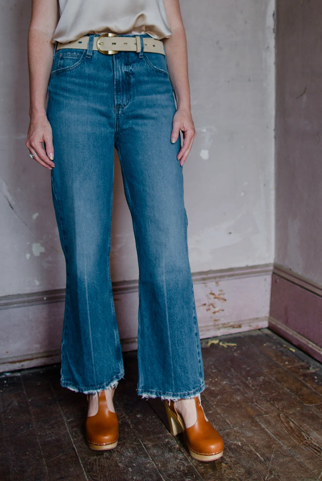 Image featuring a woman wearing the Frame Le High n Tight Crop denim jeans in Del Amo Grind wash.