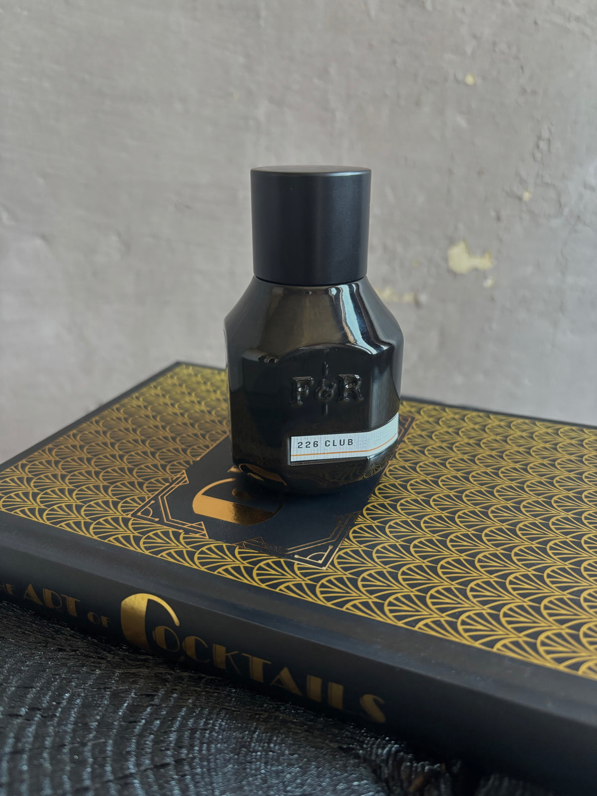 A dark bottle of Fulton and Roark extrait de parfum 226 CLUB with woody, aromatic, tonic and orange bitters scent designed to evoke a 1920's Chicago speakeasy