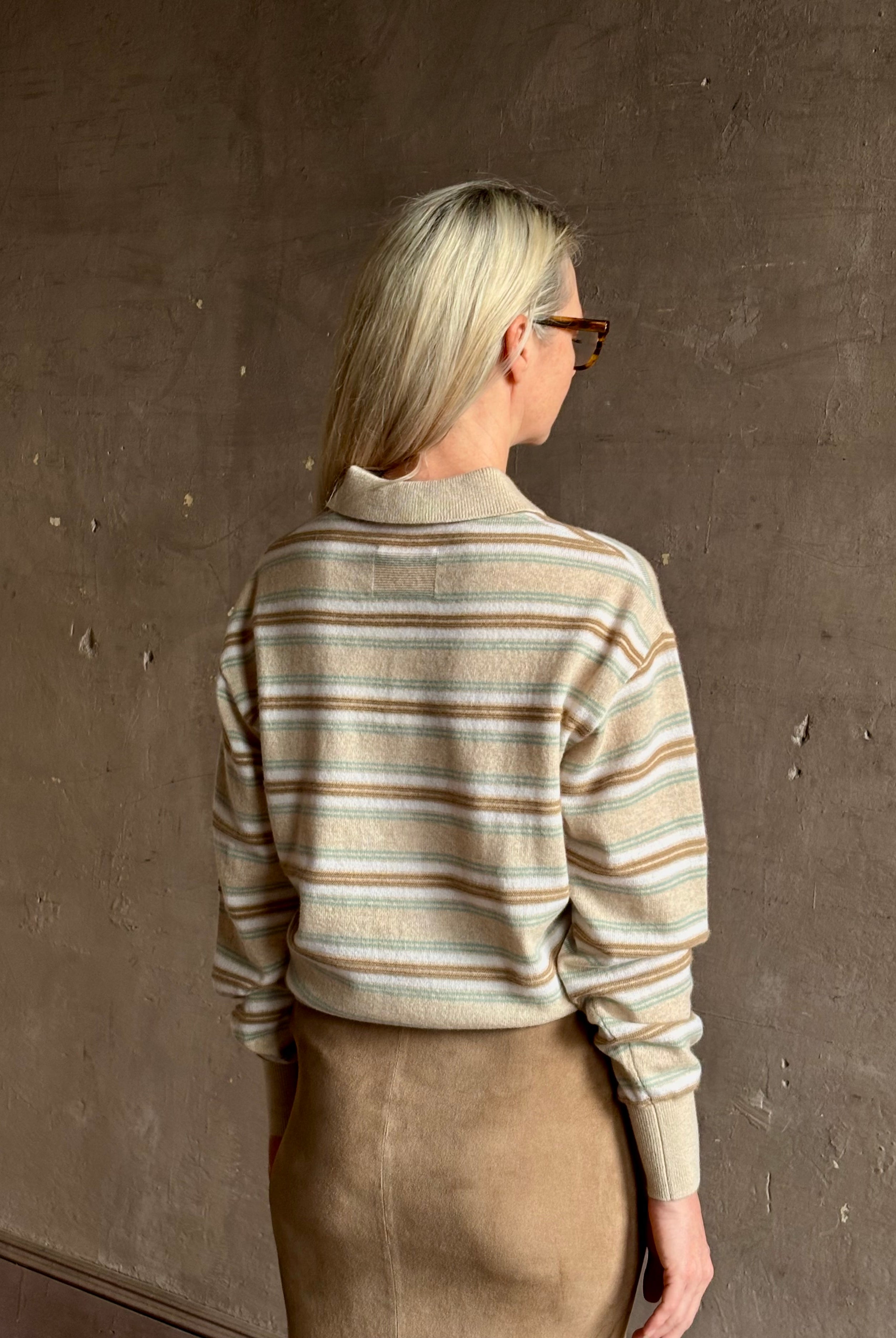 Mature woman wearing Guest in Residence Colliegate beige aqua and white striped cashmere polo sweater