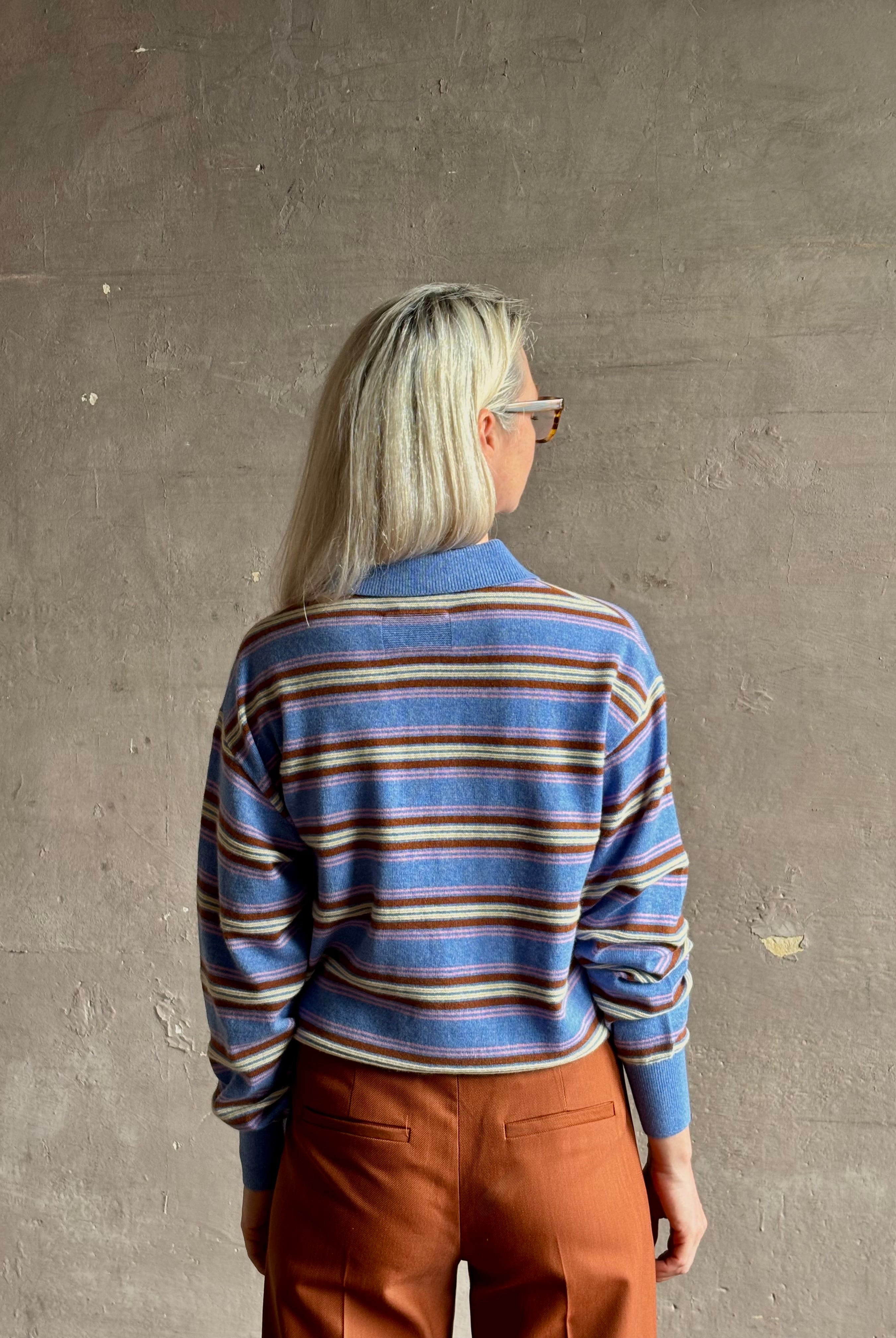 Mature woman wearing luxury Guest in Residence Colliegate delft Blue striped cashmere polo sweater long sleeves