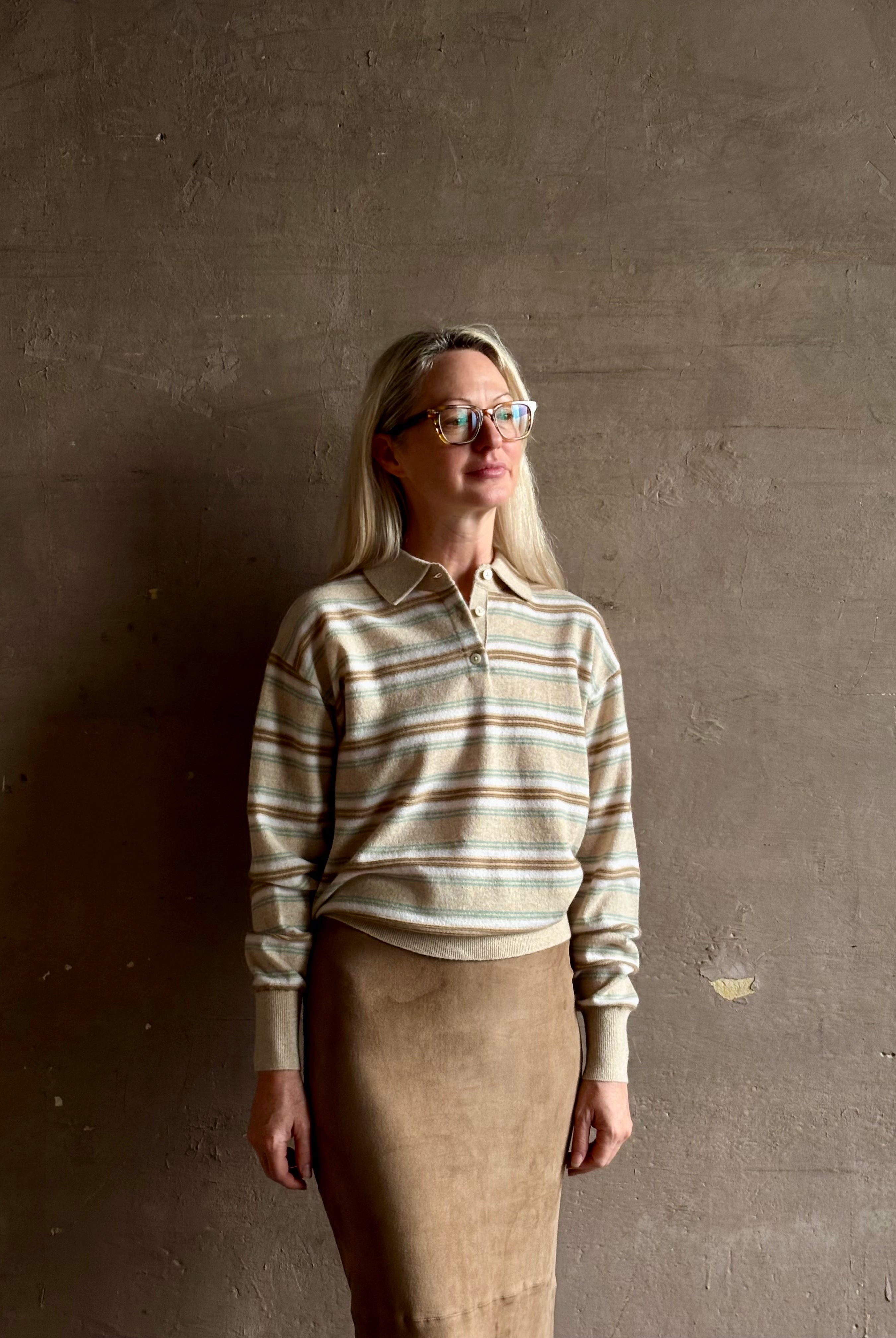 Mature woman wearing Guest in Residence Colliegate beige aqua and white striped cashmere polo sweater