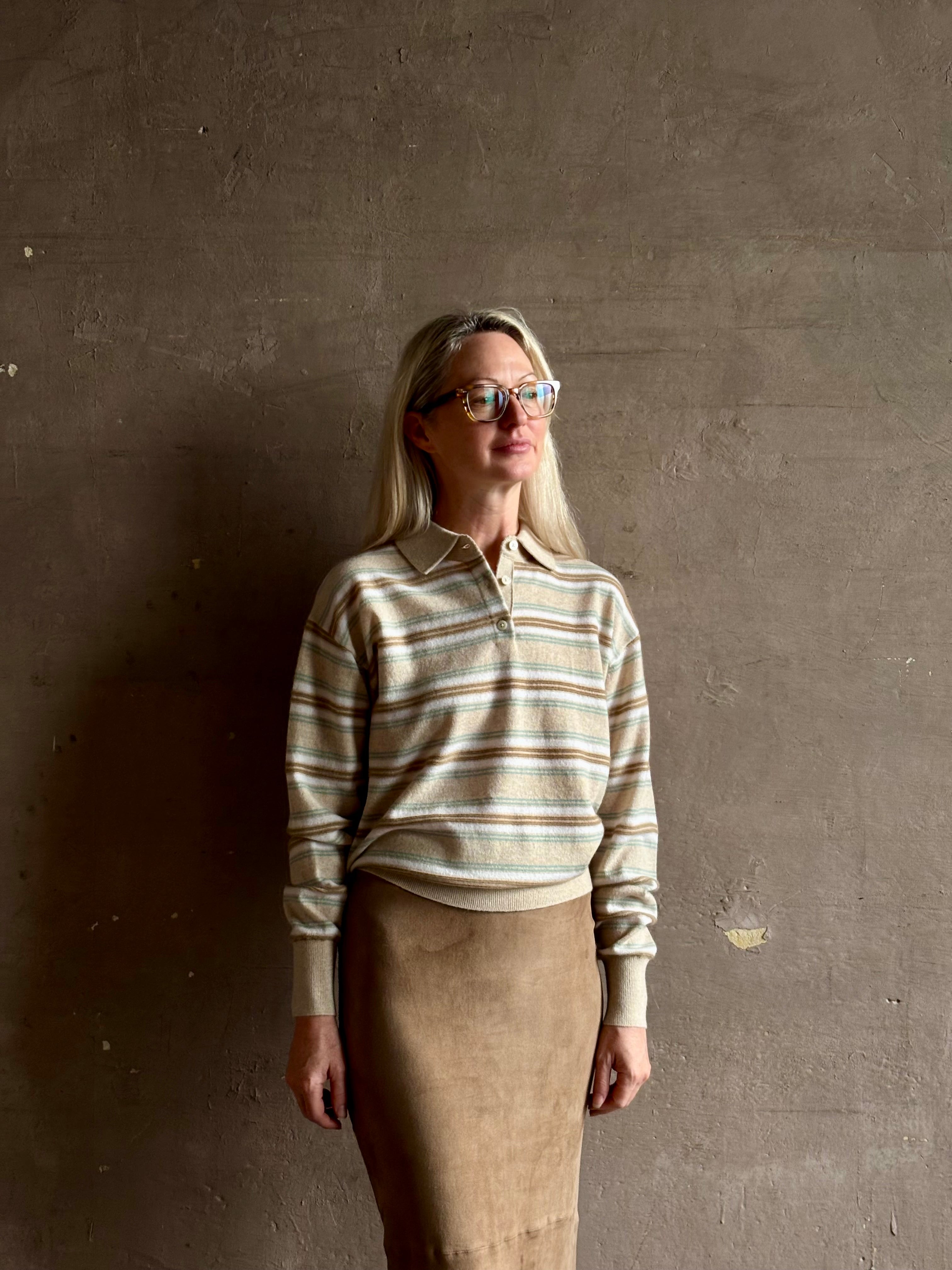 Mature woman wearing Guest in Residence Colliegate beige aqua and white striped cashmere polo sweater