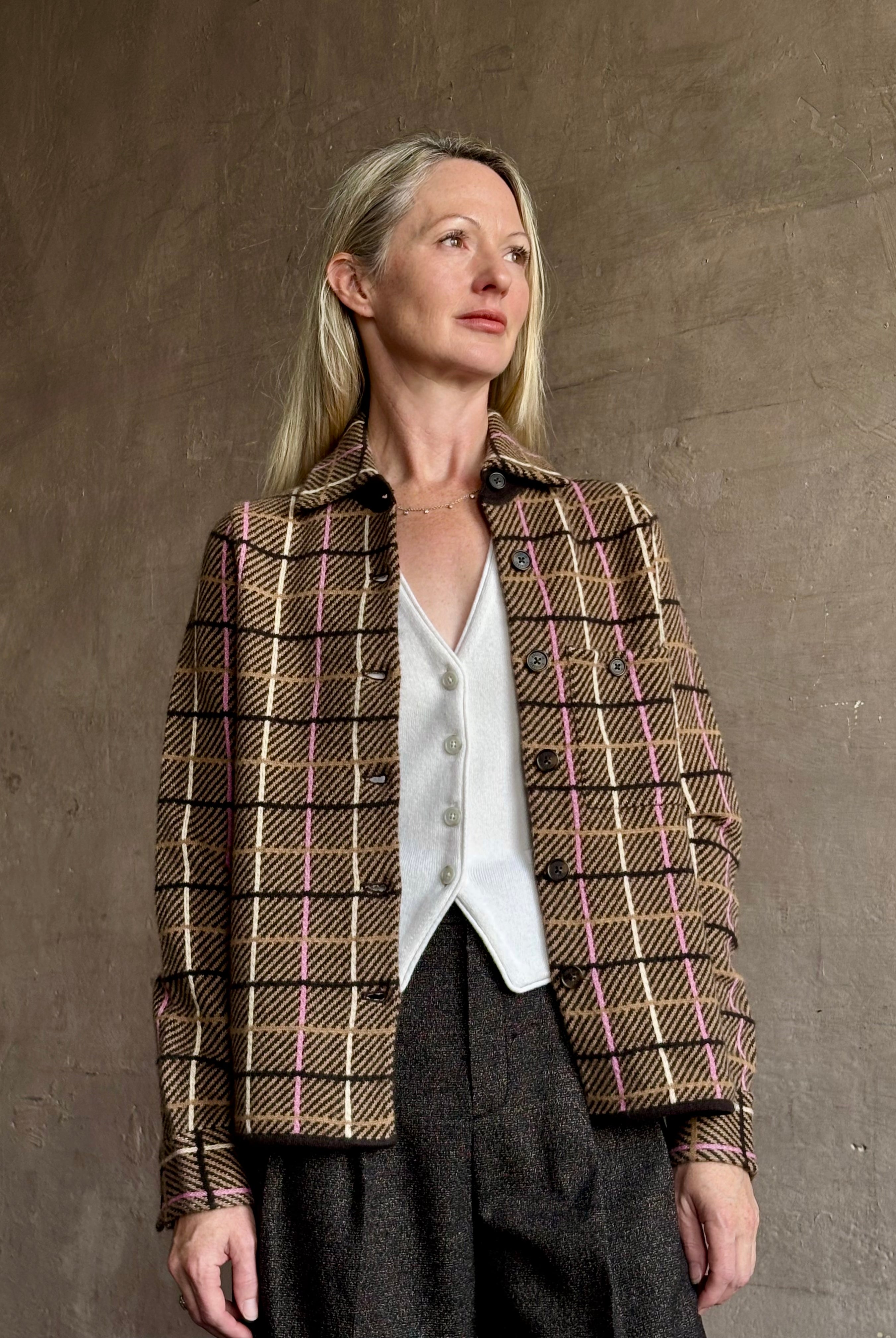 Image of mature woman wearing luxurious cashmere with versatile layering functionality from New York clothing designer Guest In Residence