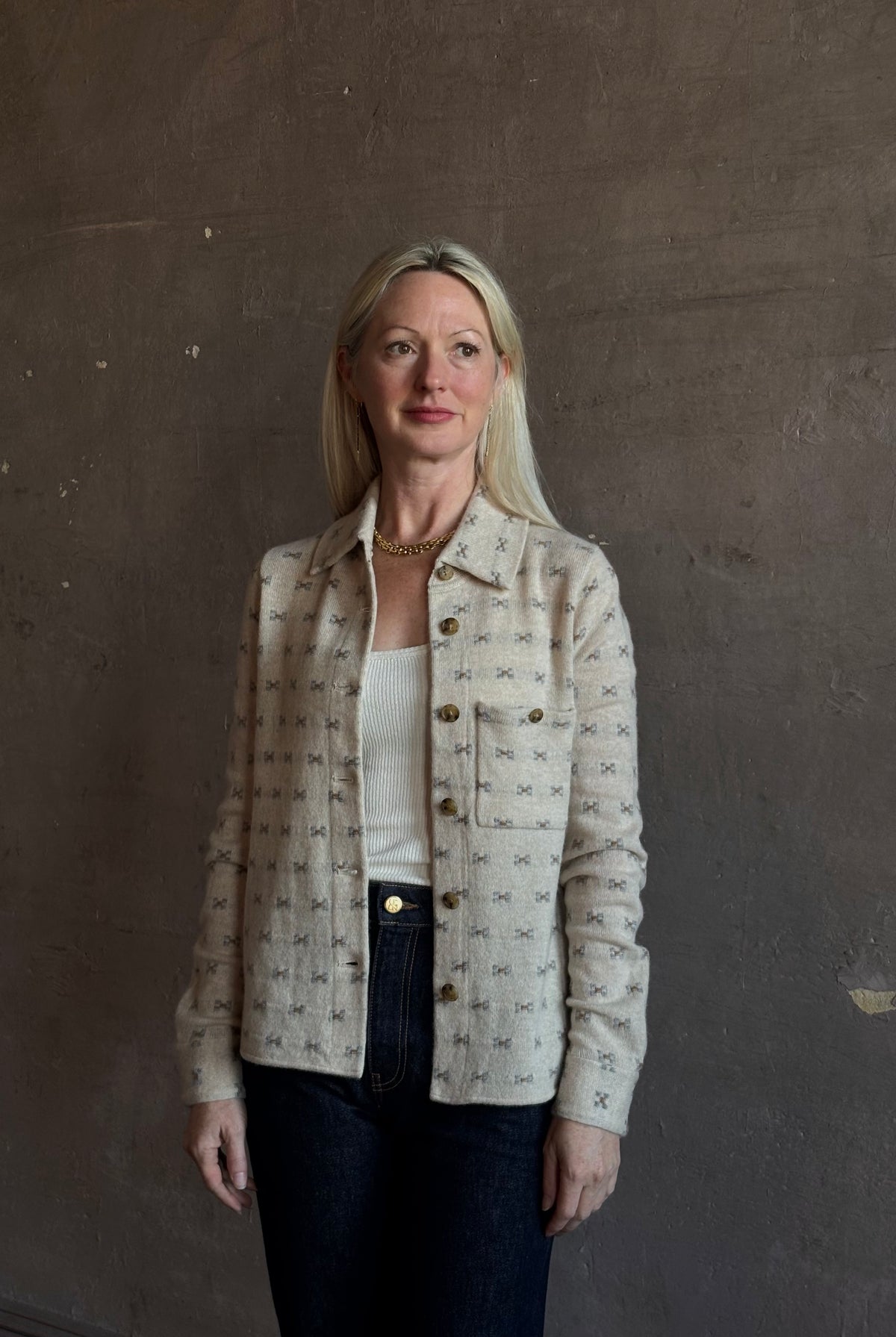Mature woman wearing Guest in Residence Dylan Tweed Shirt in Sandstone Mongolian cashmere textural tweed finish. Heirloom-quality workwear-inspired overshirt