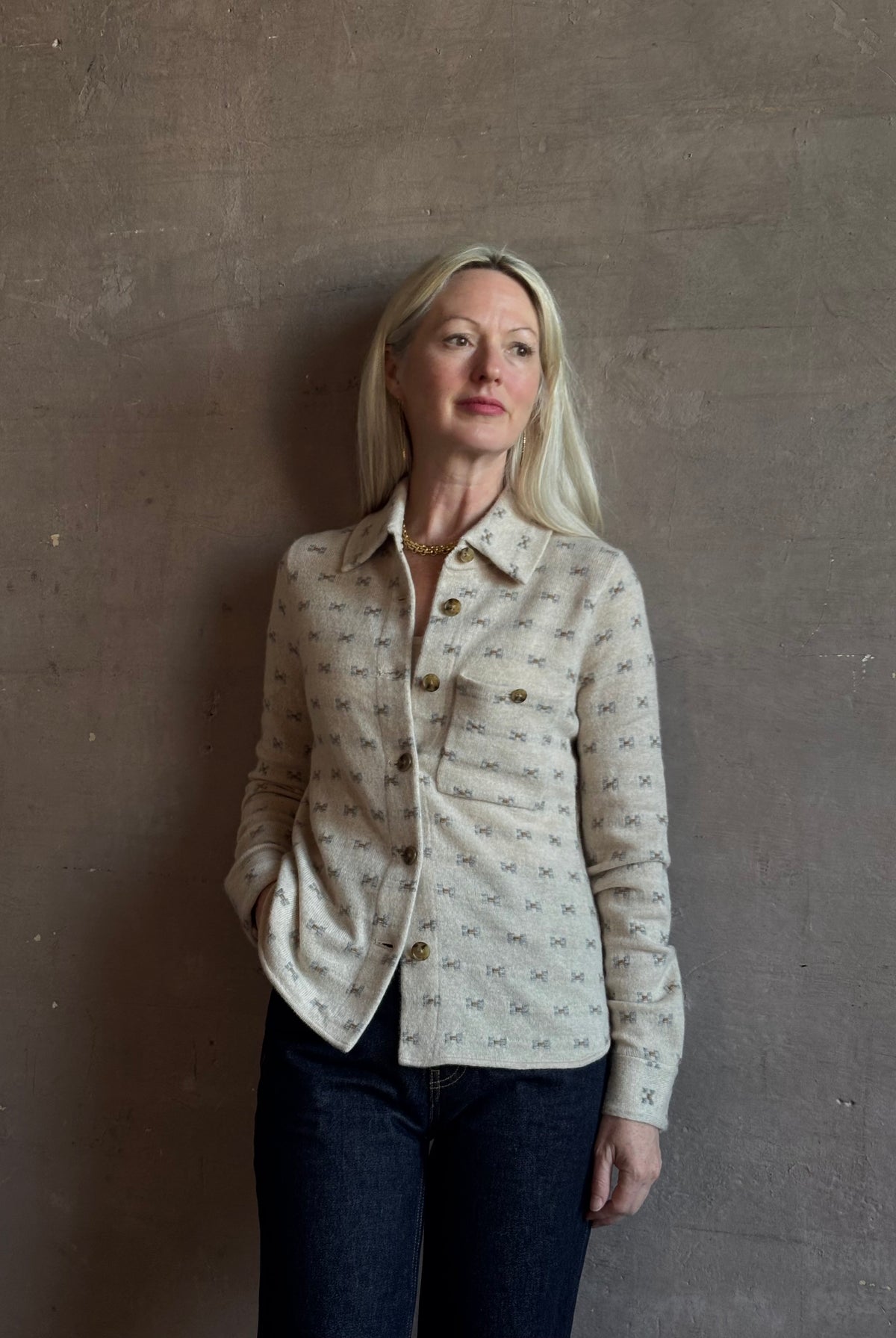 Mature woman wearing Guest in Residence Dylan Tweed Shirt in Sandstone Mongolian cashmere textural tweed finish. Heirloom-quality workwear-inspired overshirt