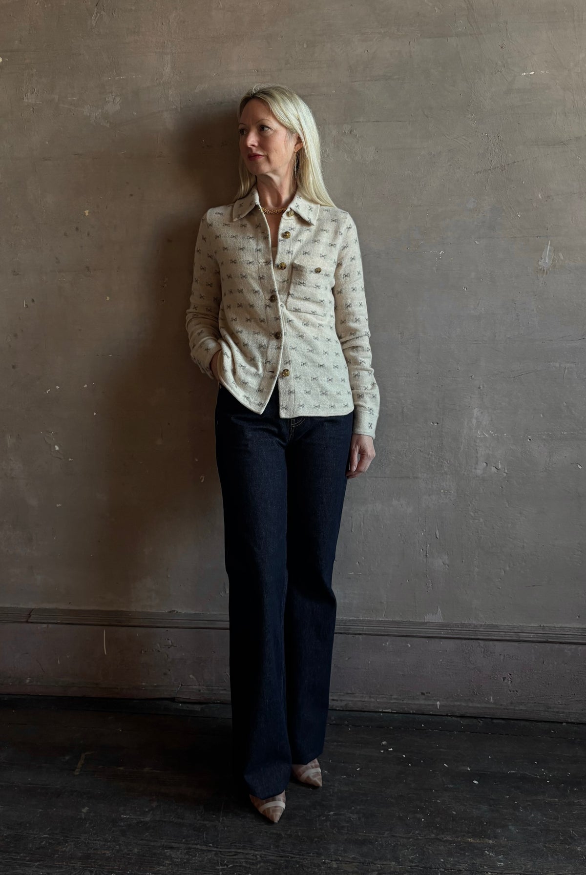Mature woman wearing Guest in Residence Dylan Tweed Shirt in Sandstone Mongolian cashmere textural tweed finish. Heirloom-quality workwear-inspired overshirt