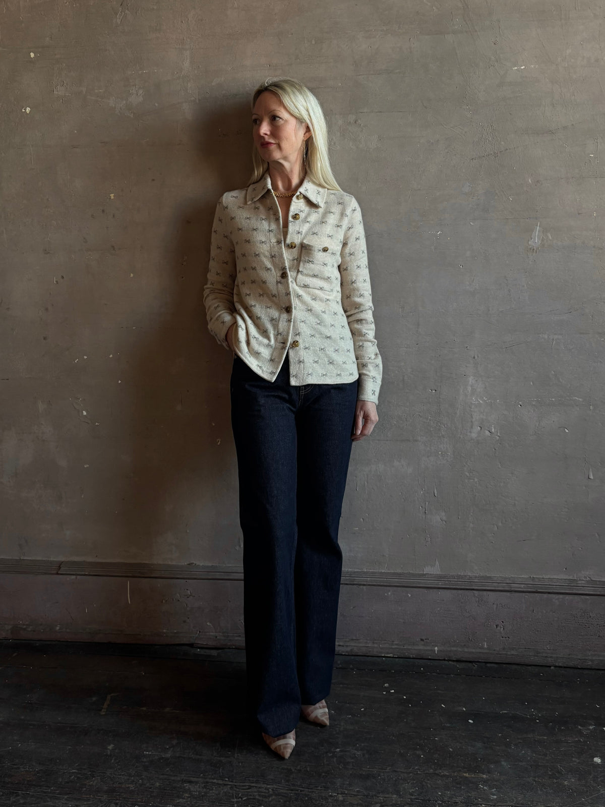 Mature woman wearing Guest in Residence Dylan Tweed Shirt in Sandstone Mongolian cashmere textural tweed finish. Heirloom-quality workwear-inspired overshirt