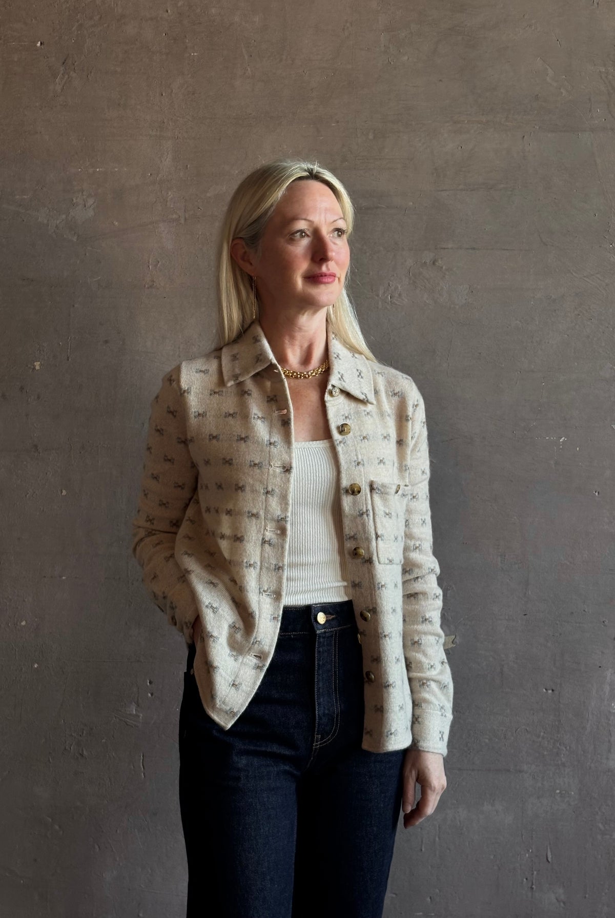 Mature woman wearing Guest in Residence Dylan Tweed Shirt in Sandstone Mongolian cashmere textural tweed finish. Heirloom-quality workwear-inspired overshirt