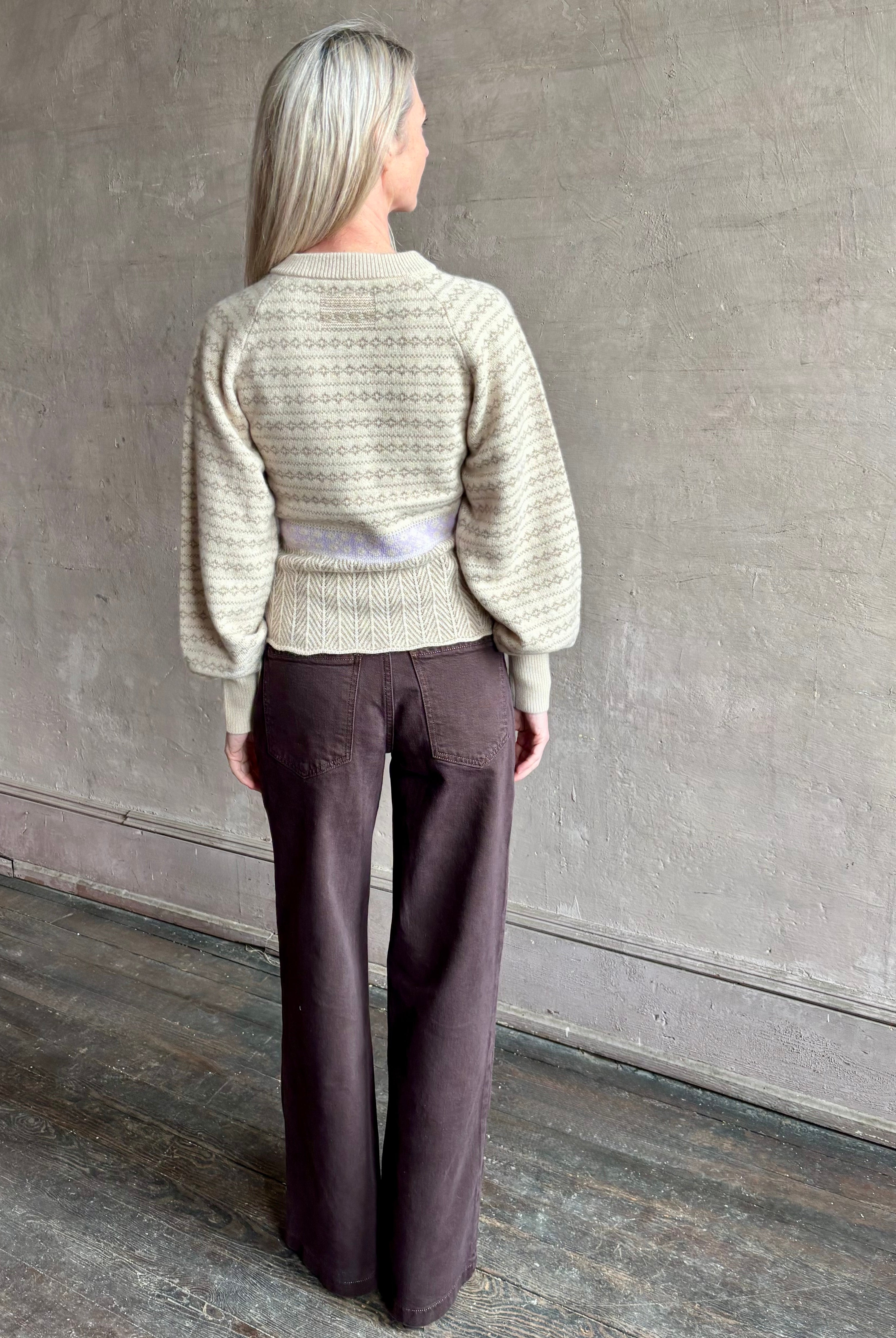 Image of mature woman wearing Guest in Residence Fairisle Cardigan in cream and beige pattern with a subtle lavender knit accent at waistline