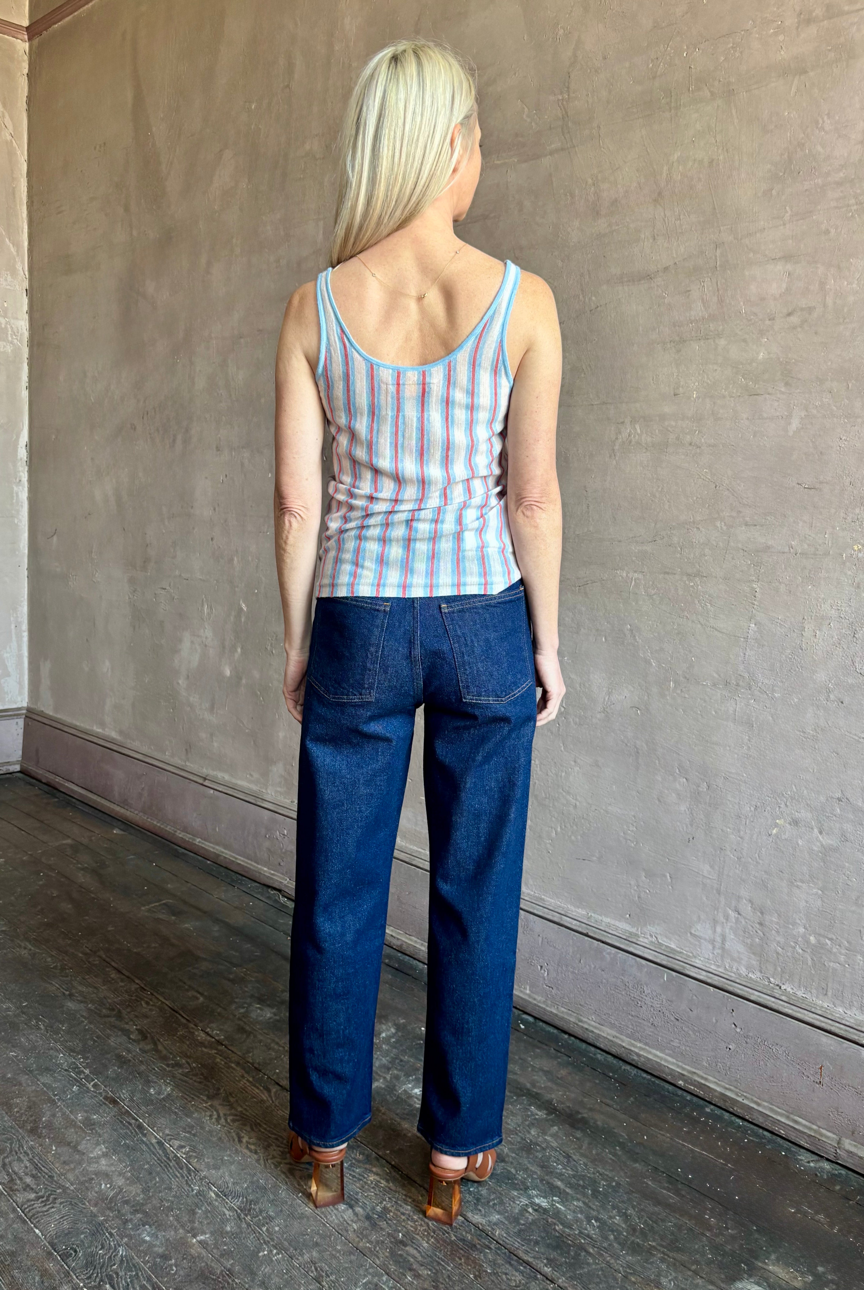 Image of woman wearing lightweight premium Mongolian cashmere GUEST IN RESIDENCE Fine Stripe sleeveless Tank in red and blue stipes with round neckline