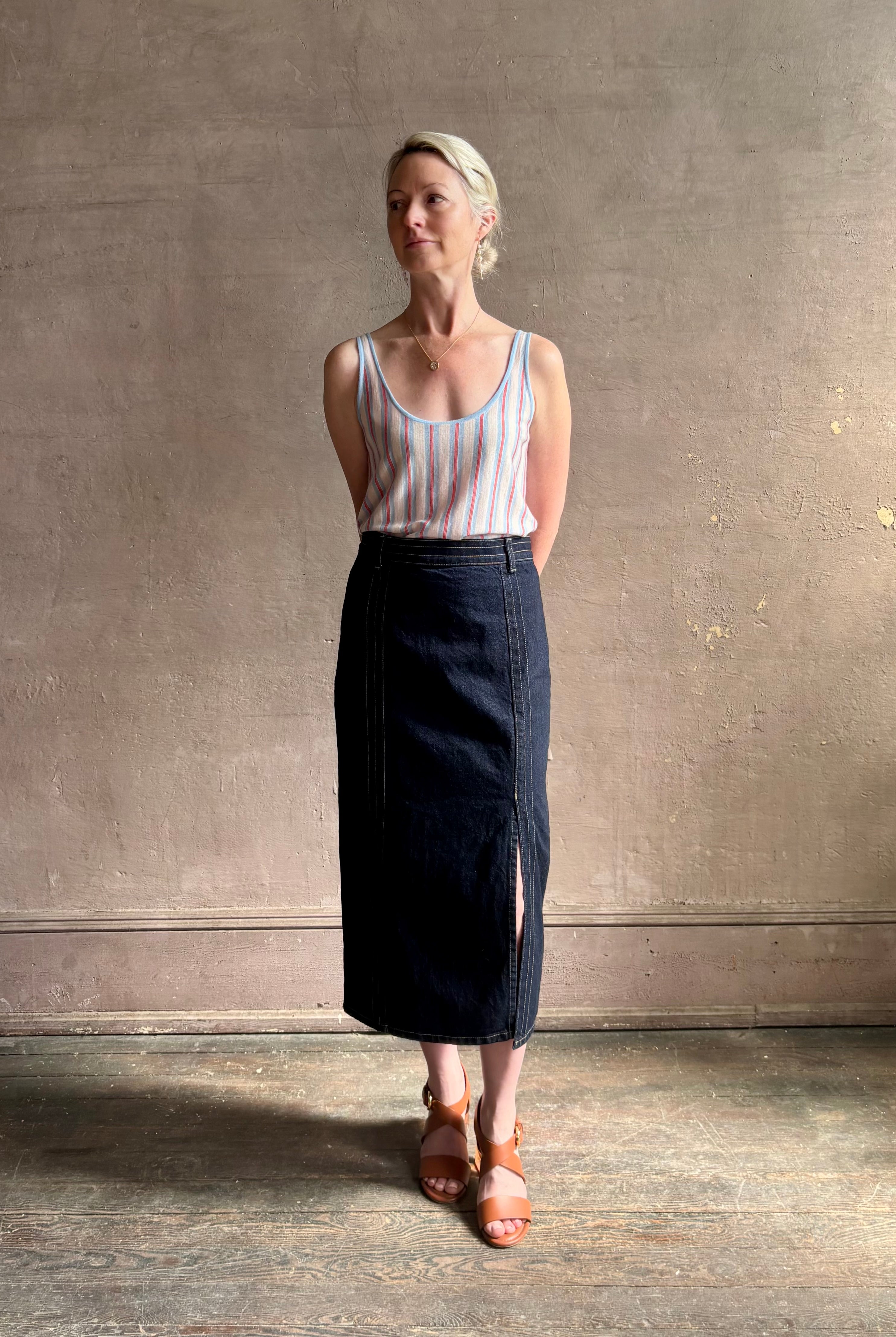 Image of woman wearing lightweight premium Mongolian cashmere GUEST IN RESIDENCE Fine Stripe sleeveless Tank in red and blue stipes with scoop neck