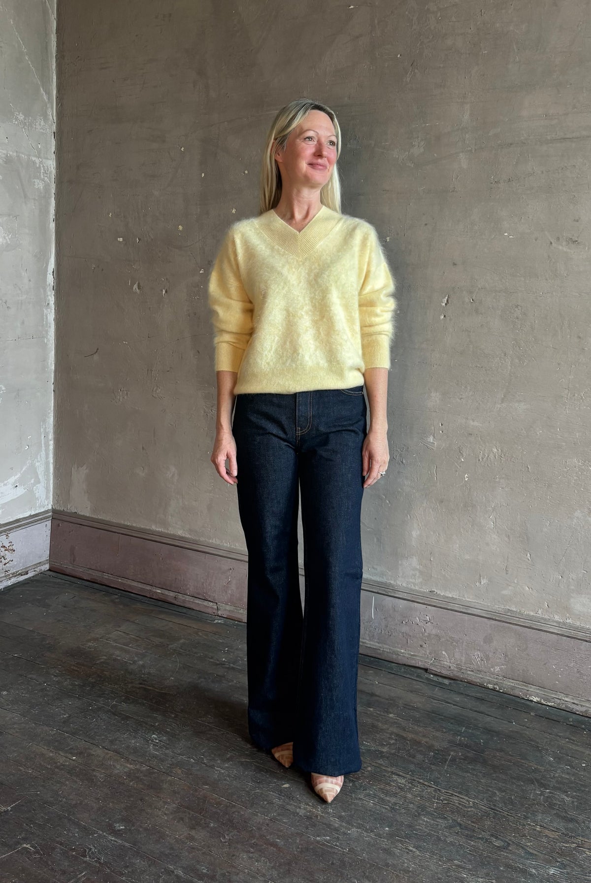Mature woman wearing Guest in Residence Grizzly Double V Sweater in Butter brushed cashmere front-and-back V-necklines long sleeves