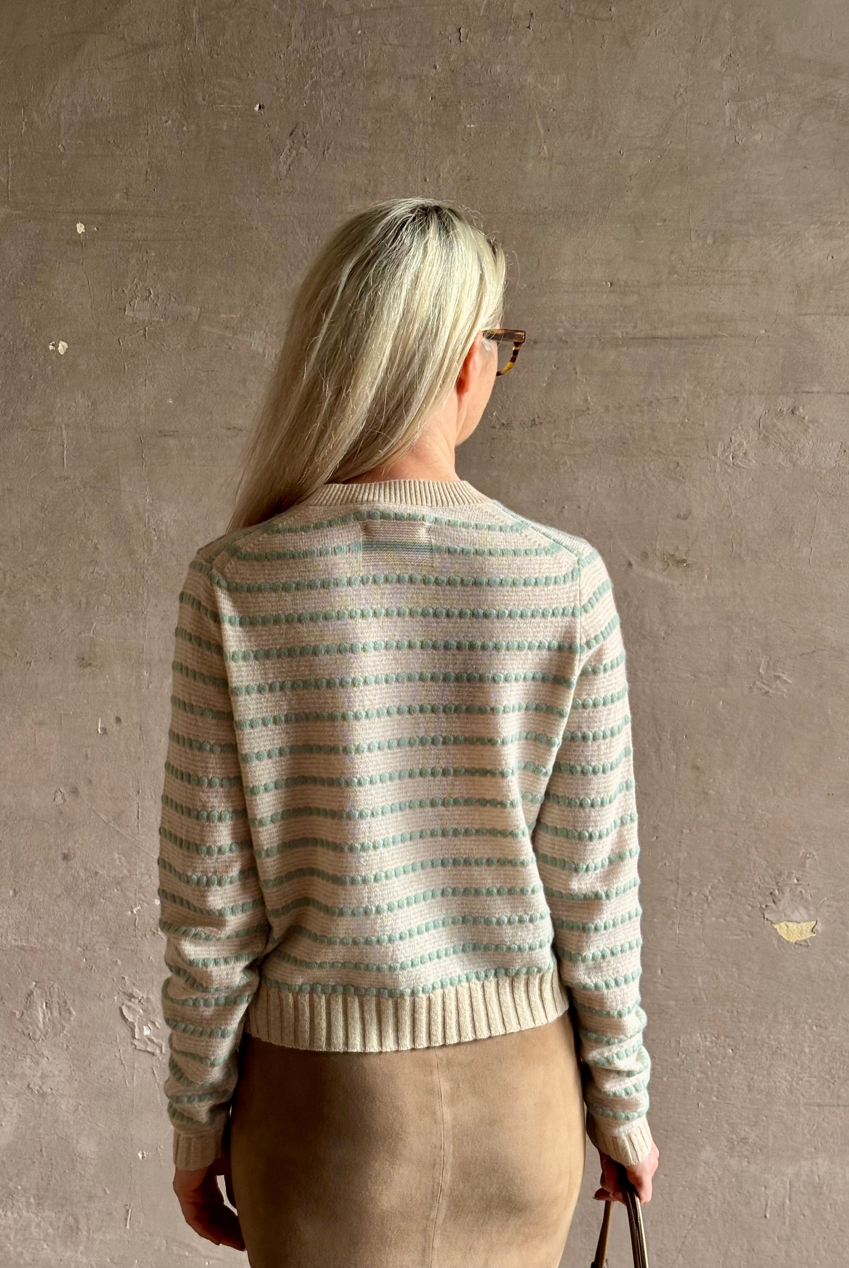 Mature woman wearing Guest in Residence Pebble cream and sage stripe shrunken crew long sleeve cashmere knit
