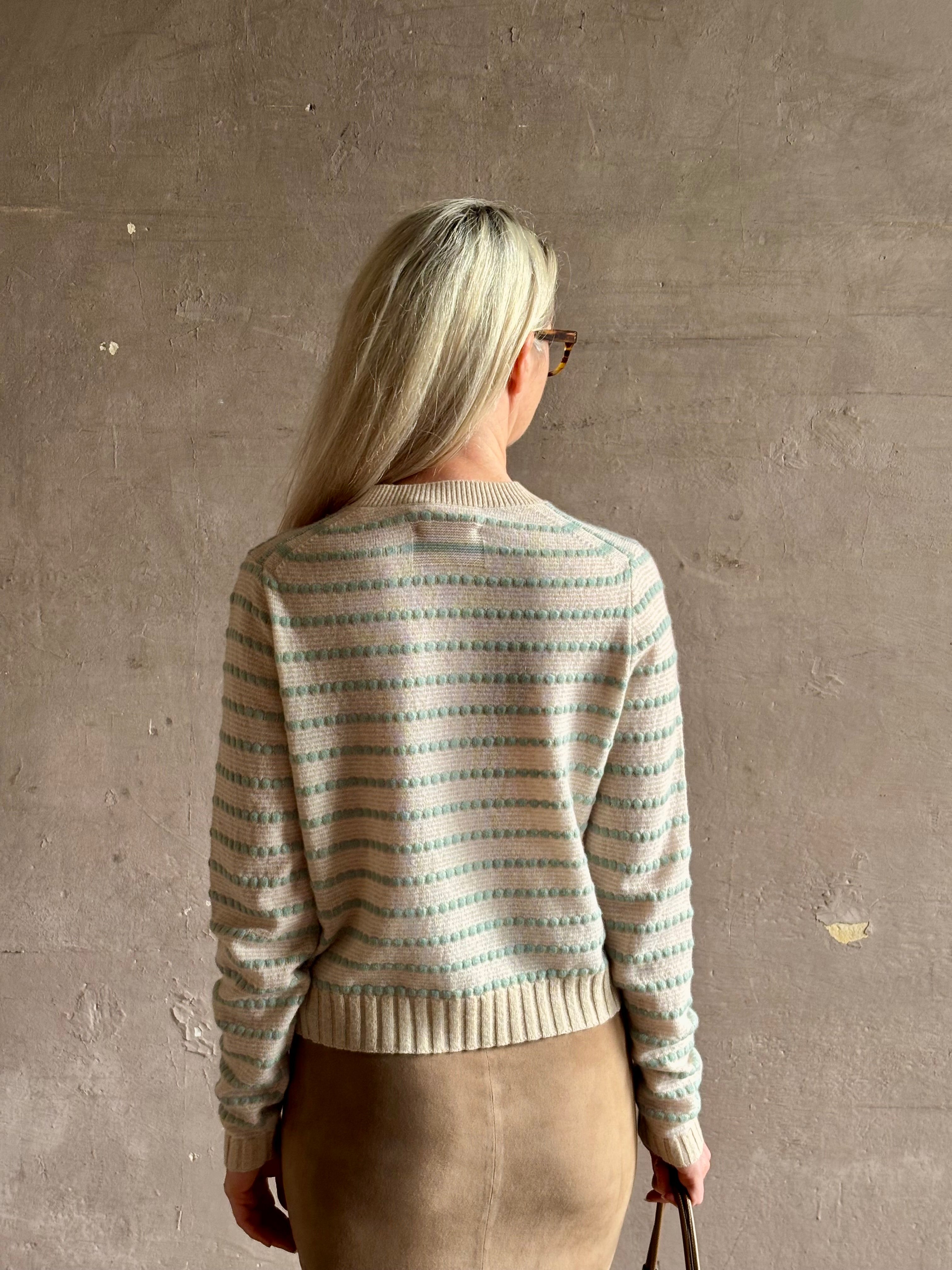 Mature woman wearing Guest in Residence Pebble cream and sage stripe shrunken crew long sleeve cashmere knit