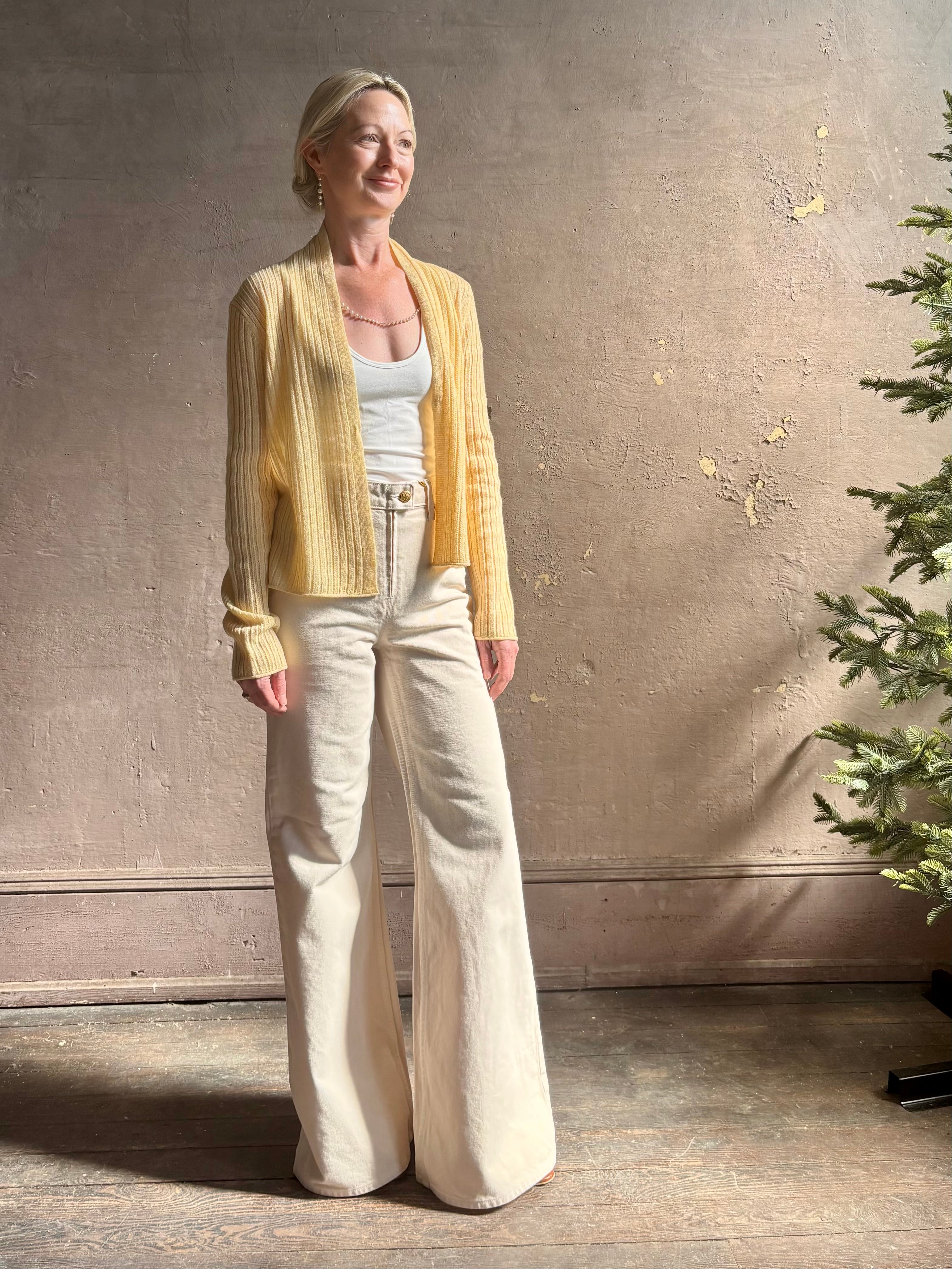 Mature woman wearing Guest in Residence Rib Stealth Cardigan layering essential in butter yellow cashmere linen blend