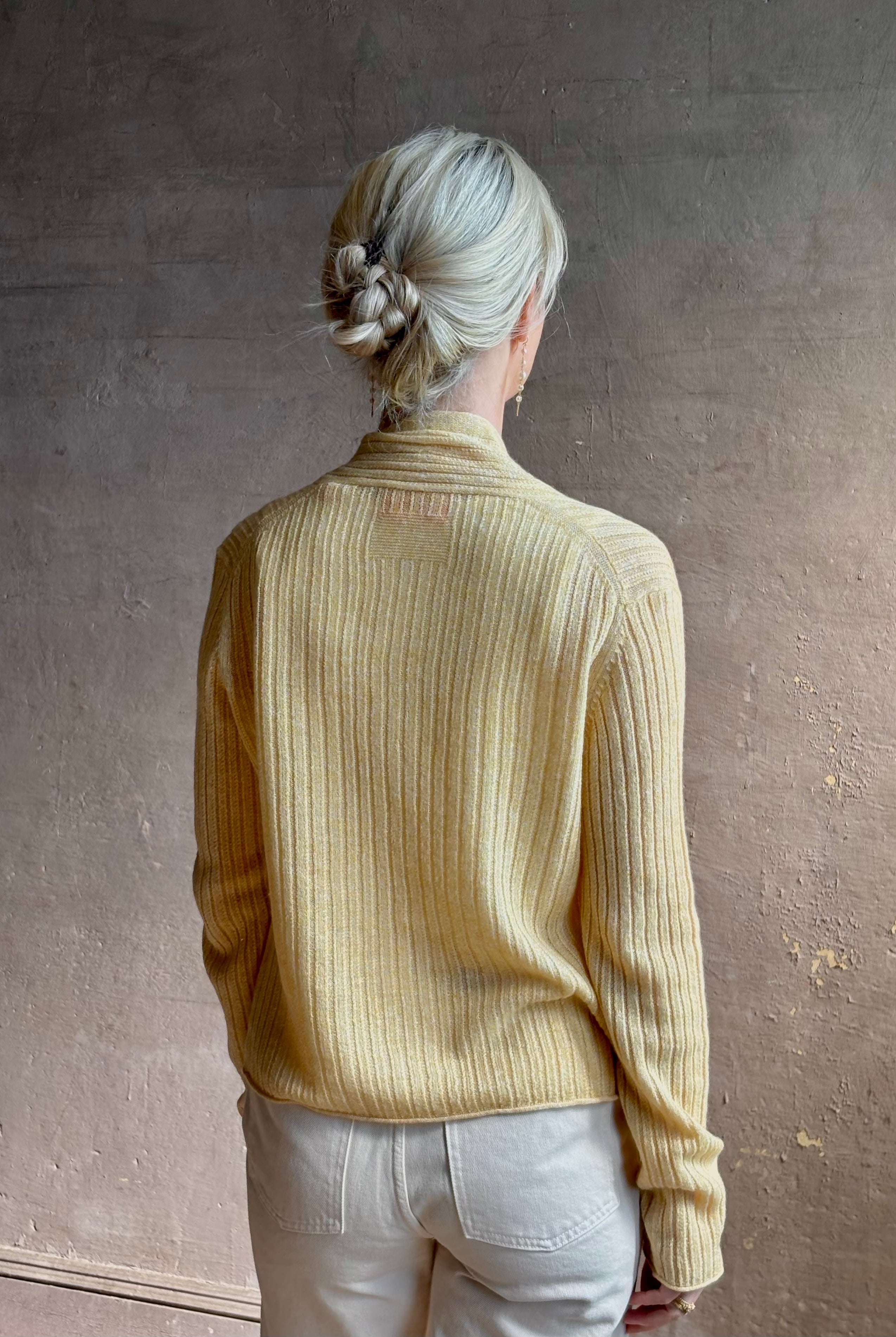 Mature woman wearing Guest in Residence Rib Stealth Cardigan layering essential in butter yellow cashmere linen blend