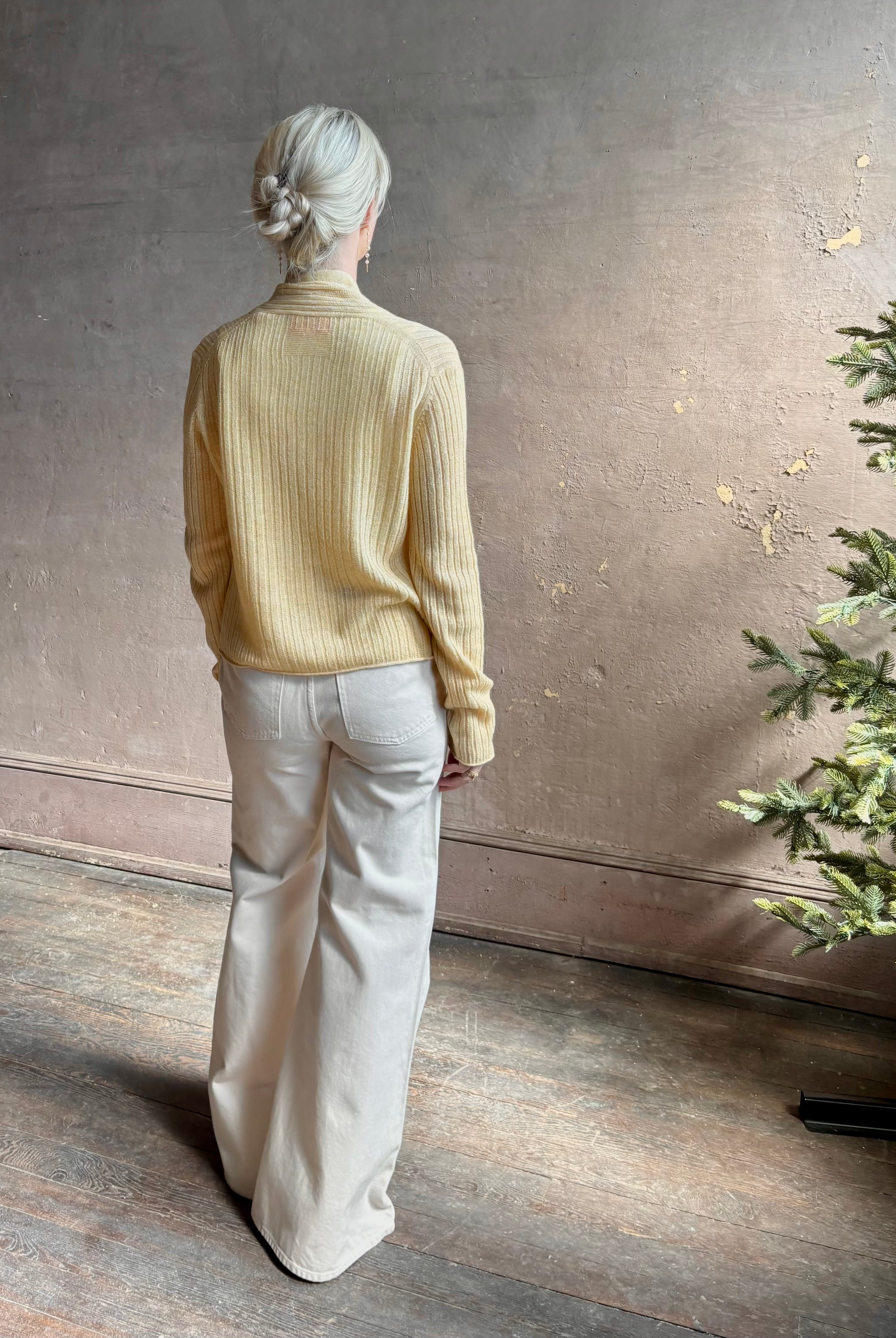 Mature woman wearing Guest in Residence Rib Stealth Cardigan layering essential in butter yellow cashmere linen blend