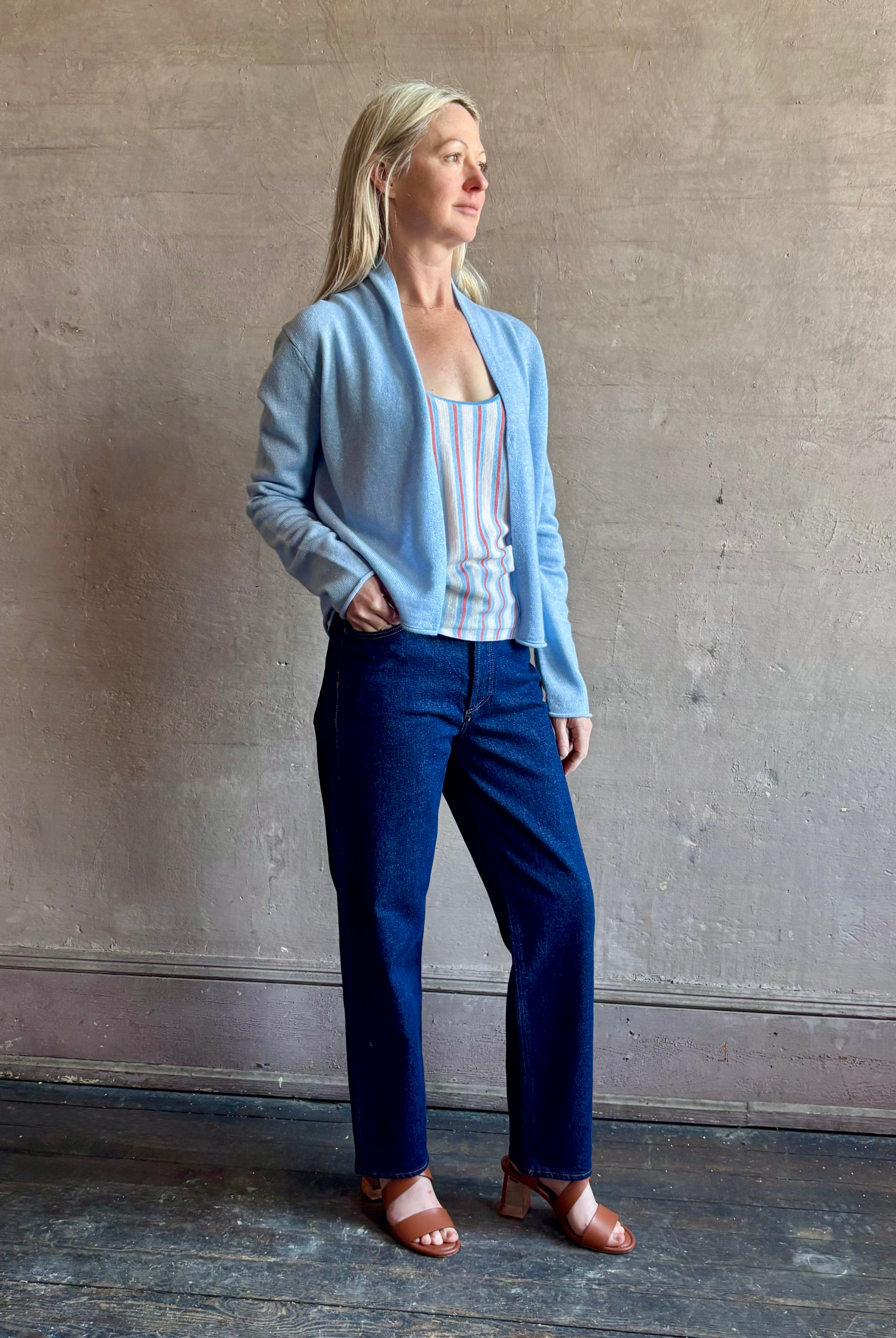 Image of woman wearing comfortable Clear Sky blue Guest in Residence Stealth cashmere linen lightweight Cardigan with long sleeves and open front with single hook and eye closure