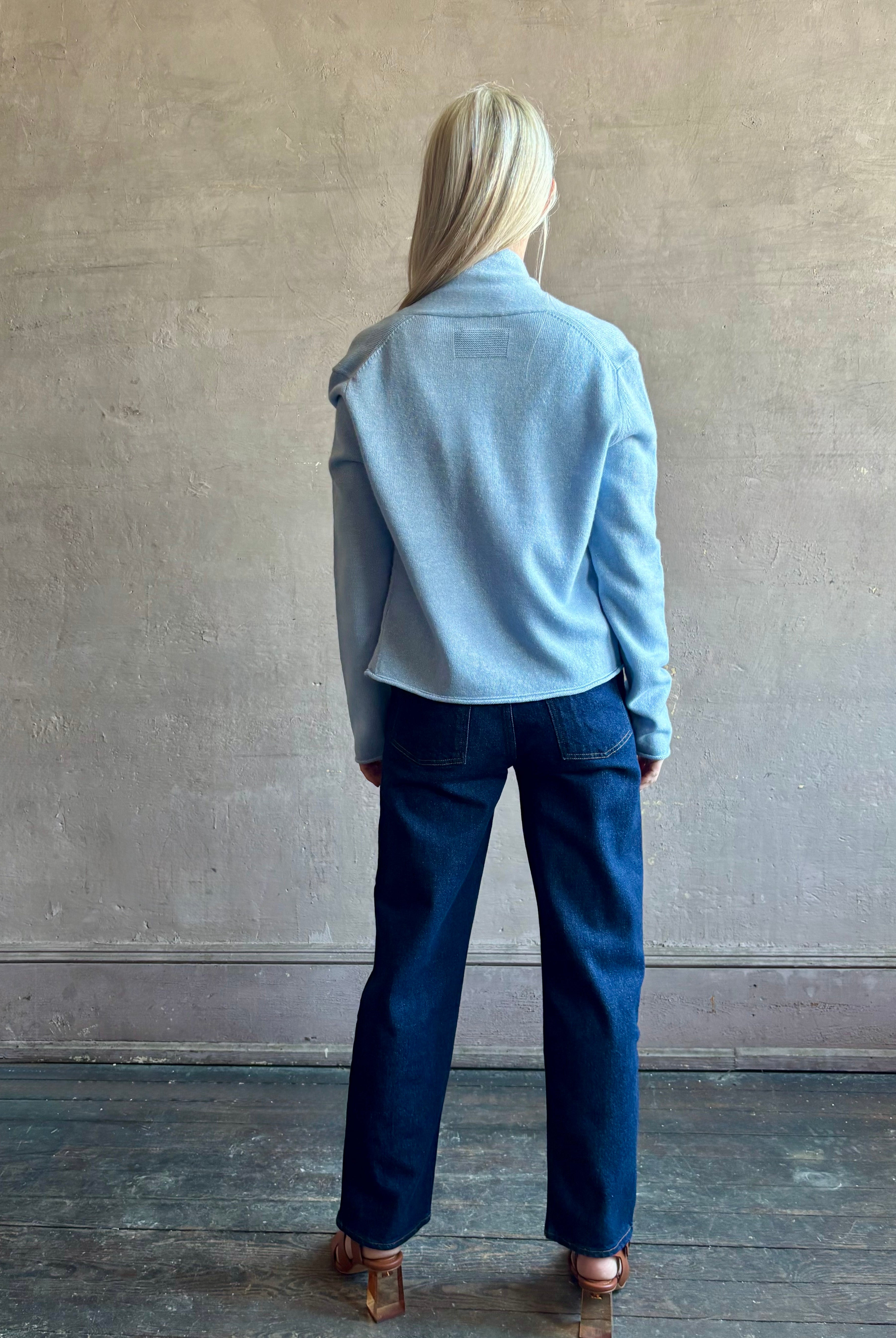 Image of woman wearing comfortable Clear Sky blue Guest in Residence Stealth cashmere linen lightweight Cardigan with long sleeves and open front with single hook and eye closure