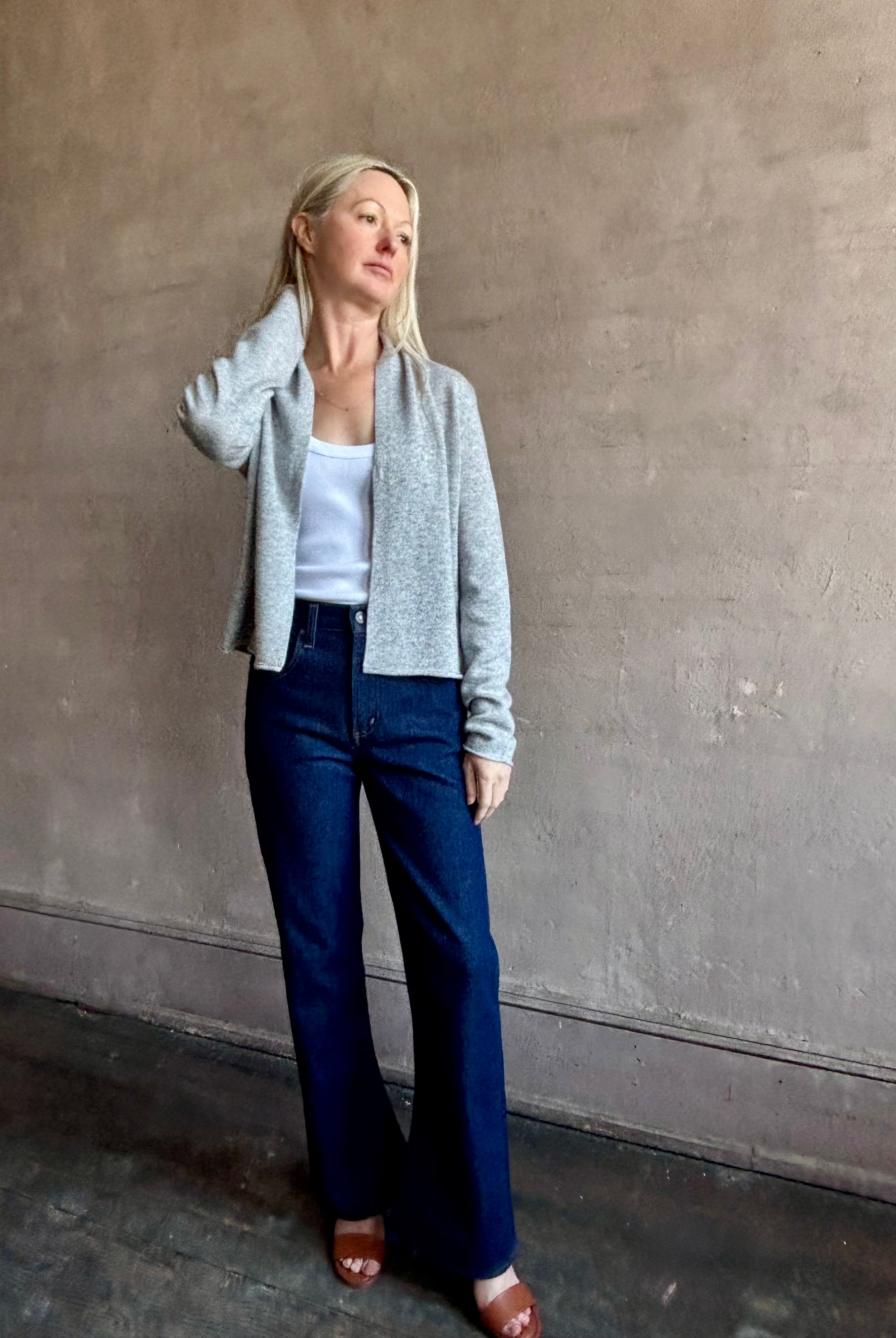 image of woman wearing comfortable stone grey cashmere linen GUEST IN RESIDENCE Stealth Cardigan with single hook and eye front closure