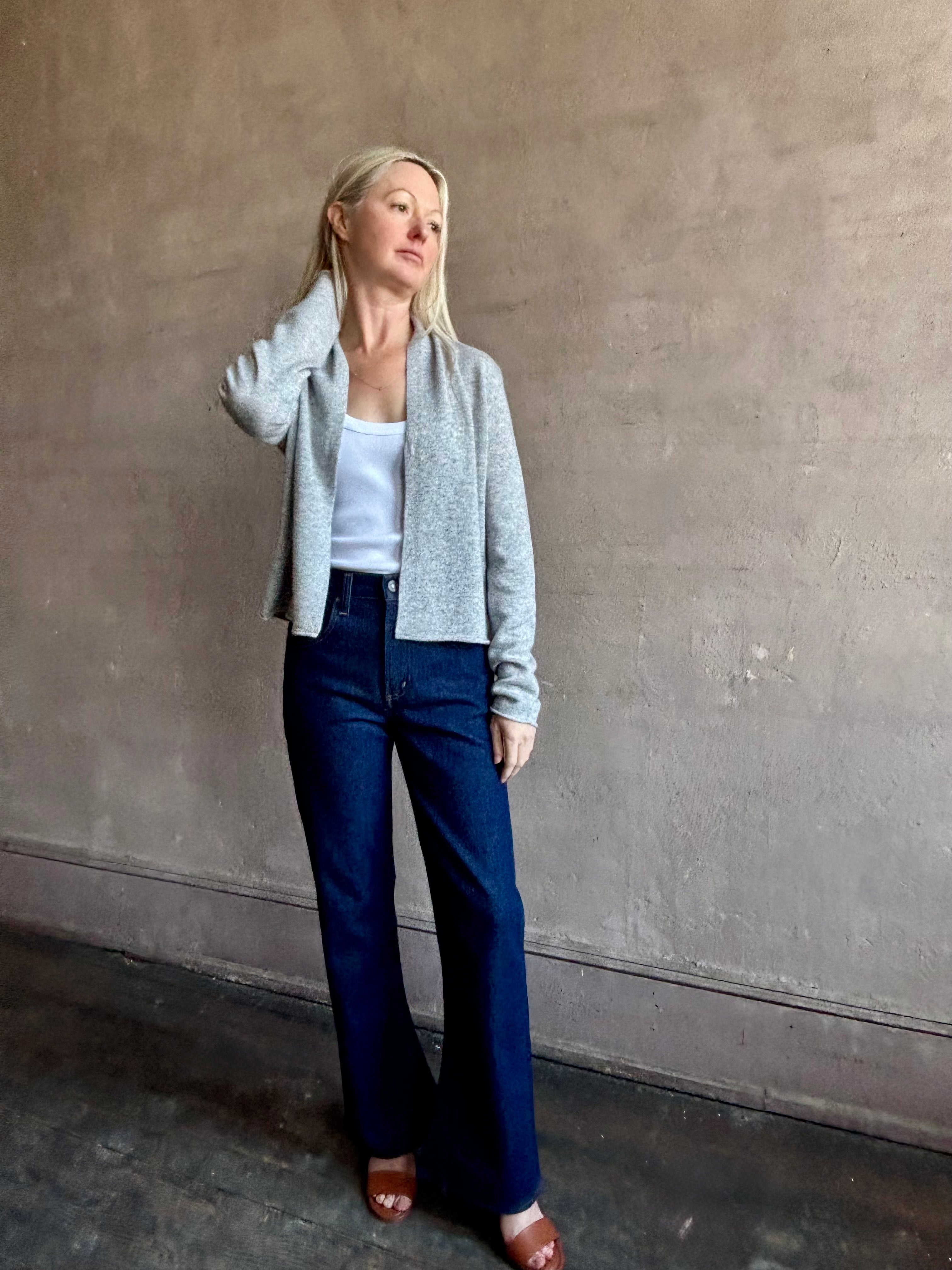image of woman wearing comfortable stone grey cashmere linen GUEST IN RESIDENCE Stealth Cardigan with single hook and eye front closure