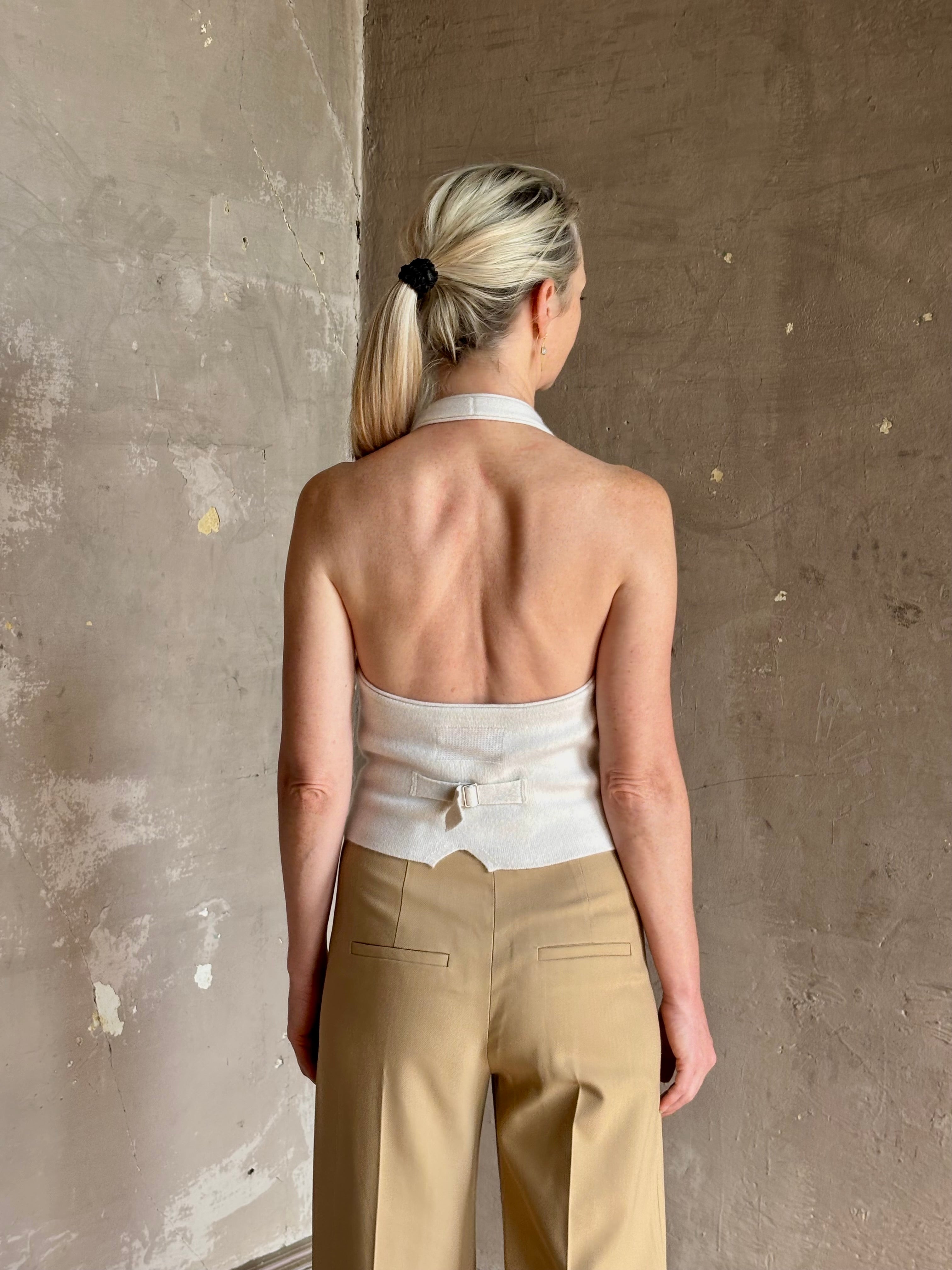 Mature woman wearing Guest in Residence premium cashmere halter top backless white expert tailoring