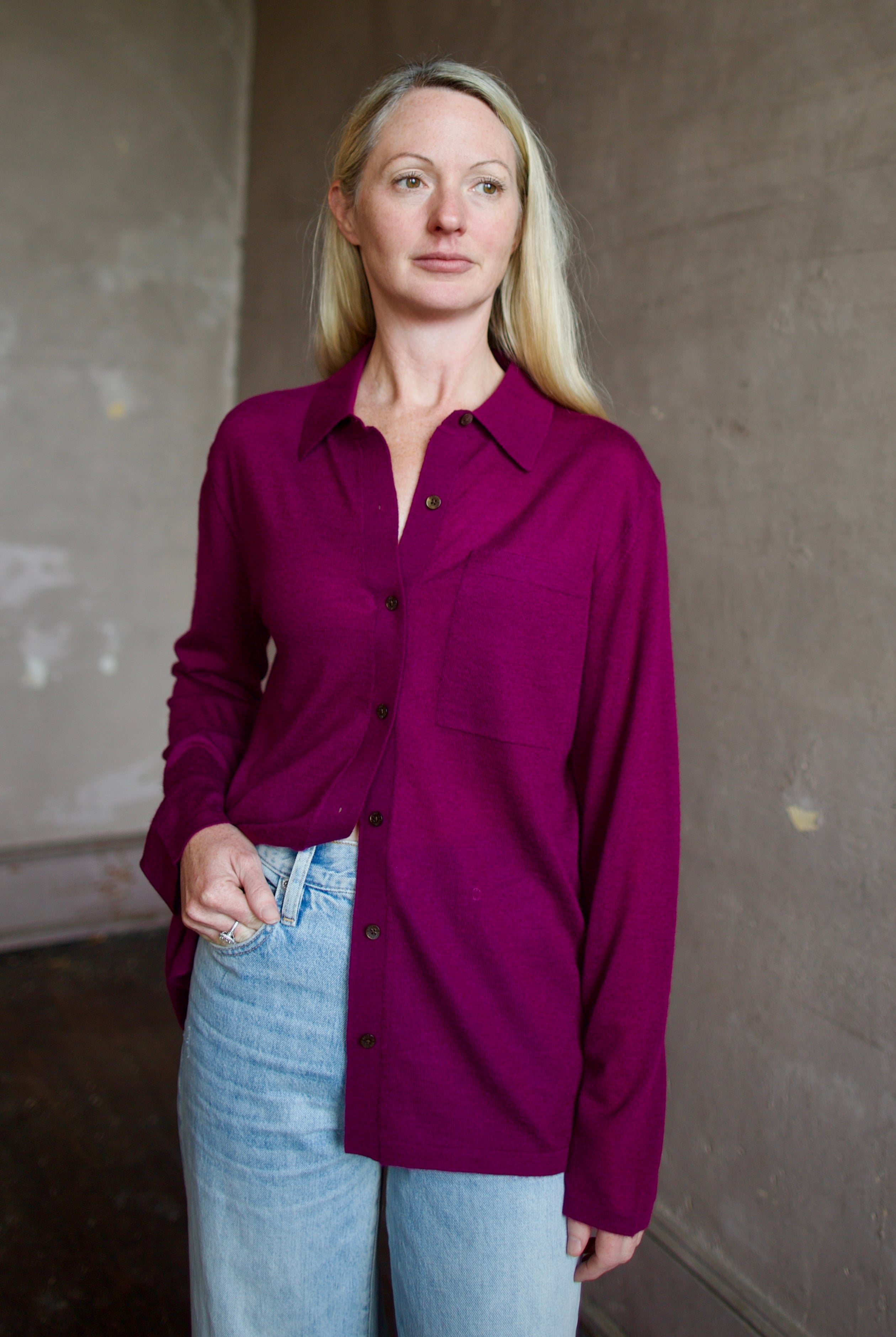 Model wearing the designer Guest In Residence Showtime shirt in Aubergine button up premium cashmere long sleeve shacket