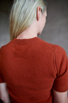 Model wearing cropped cinnamon short sleeve premium cashmere sweater from Guest in Residence