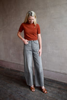 Model wearing cropped cinnamon short sleeve premium cashmere sweater from Guest in Residence