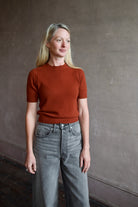 Model wearing cropped cinnamon short sleeve premium cashmere sweater from Guest in Residence