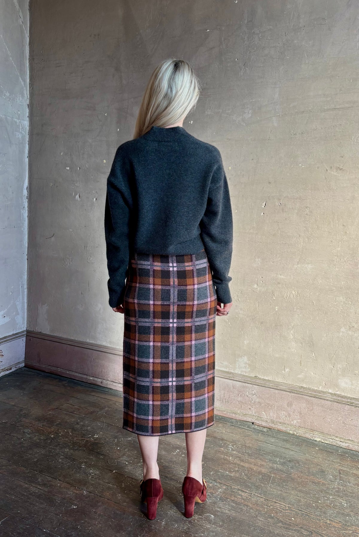 Mature woman wearing Guest in Residence Tartan Wrap Skirt in Sprinkle Combo wool-cashmere midi pencil silhouette and fringe trim