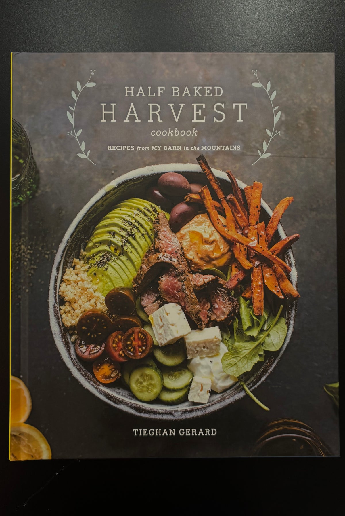 Image of front cover of the book 'Half Baked Harvest Cookbook' by Tieghan Gerard, featuring a colorful bowl of food
