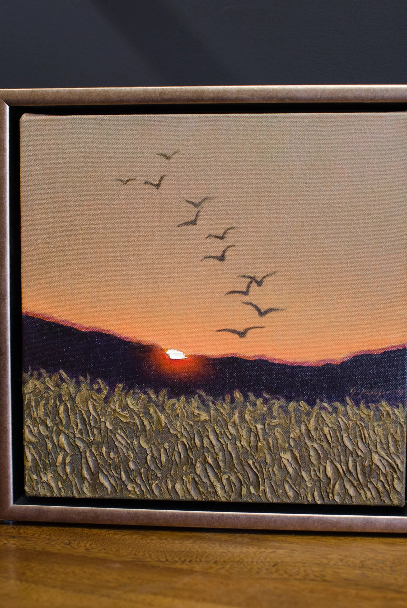 Image featuring original oil on canvas by North Carolina fine art painter Janet Green Jacobson with the setting sun and mountain range