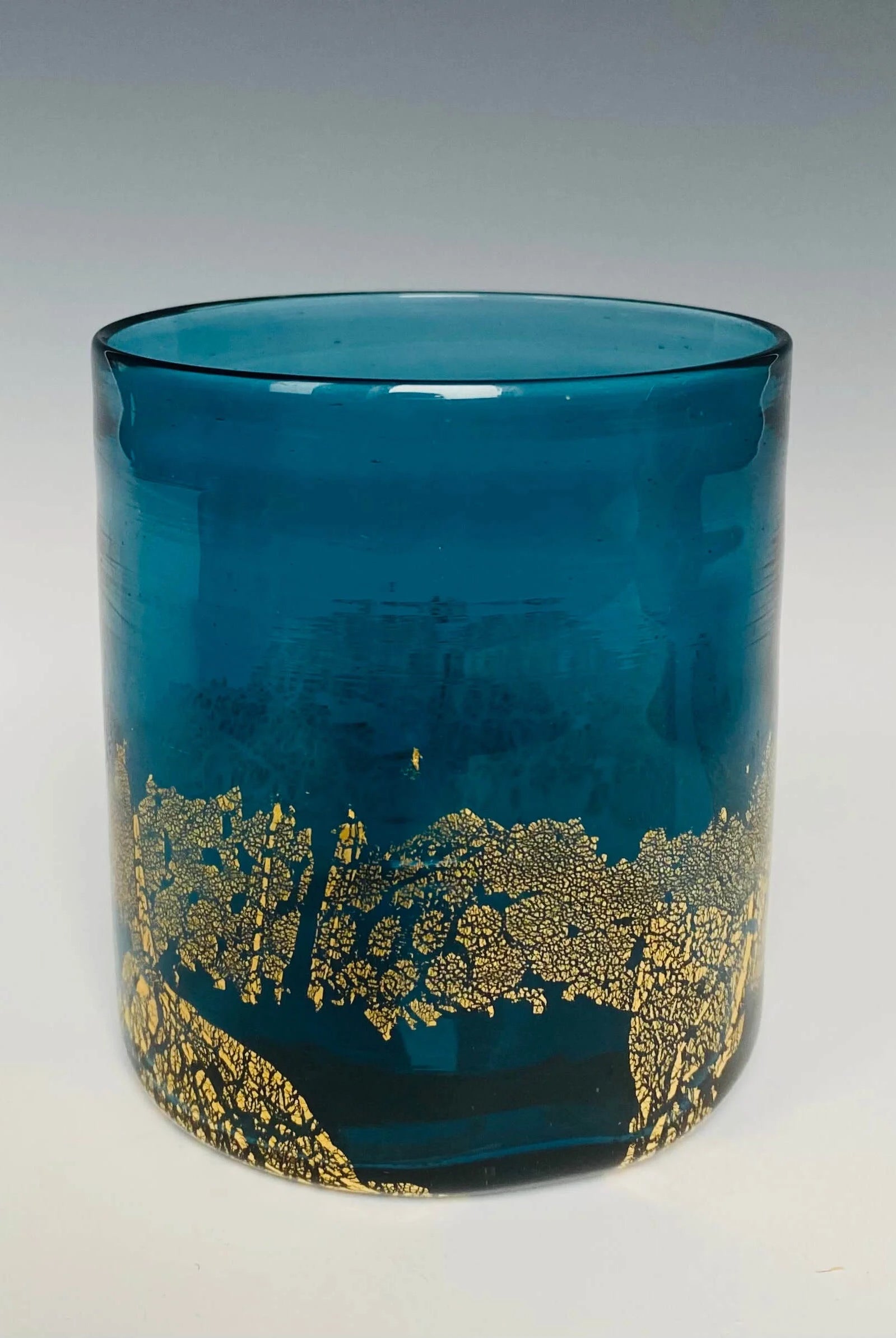 Image of a blue glass with 18k gold hand blown rocks glass made in USA by North Carolina glass artist John Shoemaker