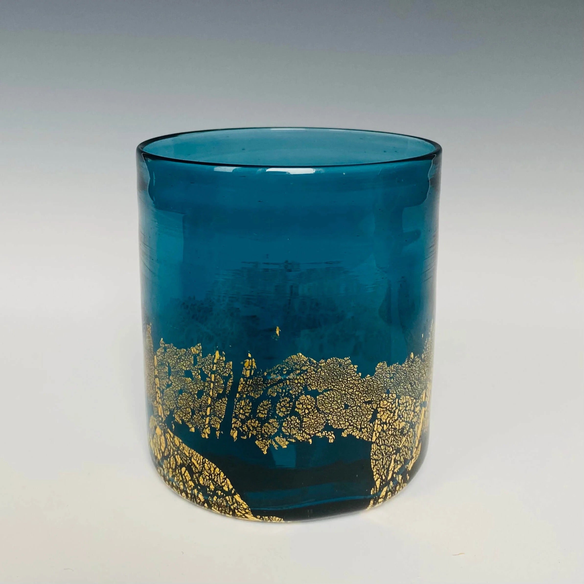 Image of a blue glass with 18k gold hand blown rocks glass made in USA by North Carolina glass artist John Shoemaker