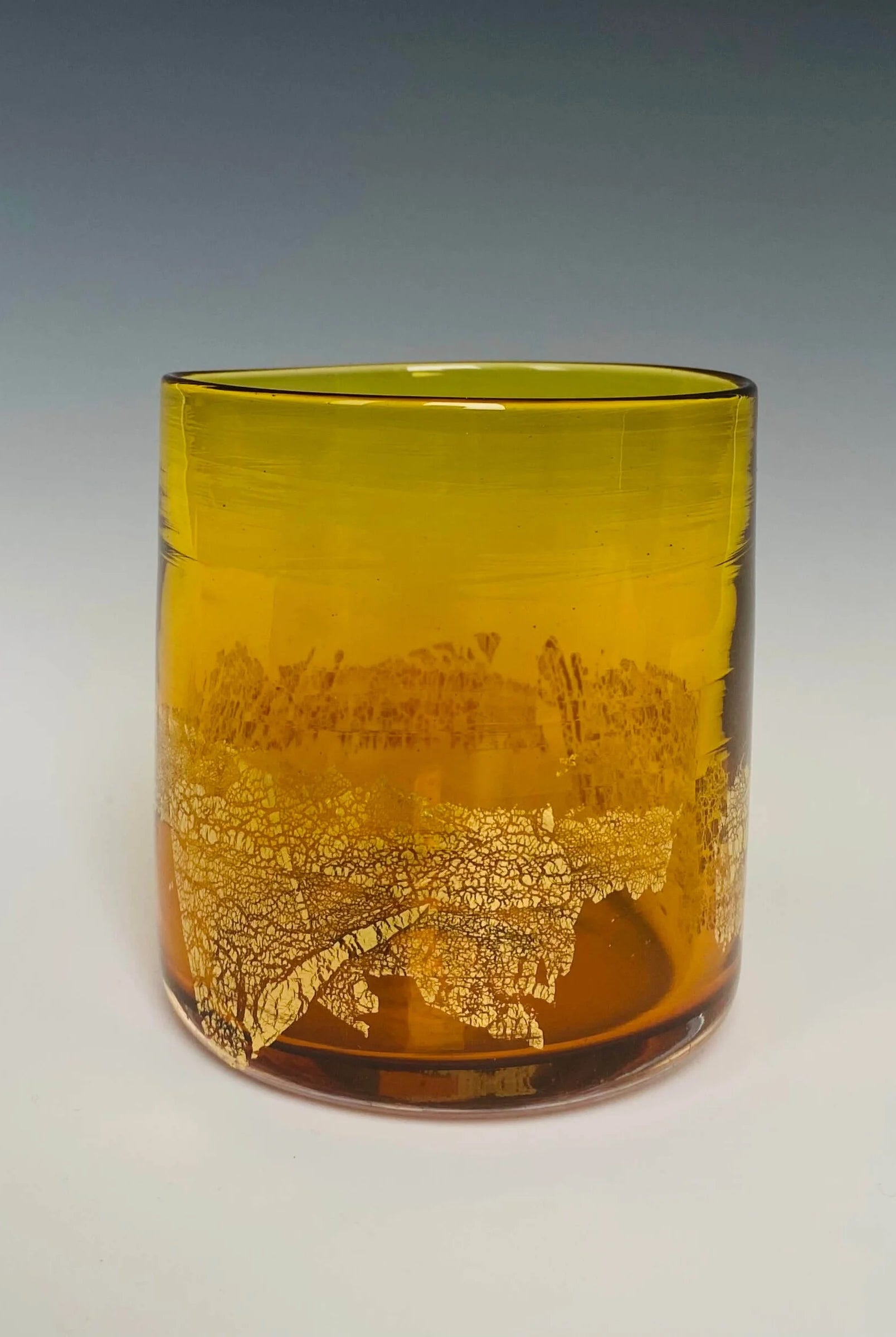Image of a gold glass with 18k gold hand blown rocks glass made in USA by North Carolina glass artist John Shoemaker