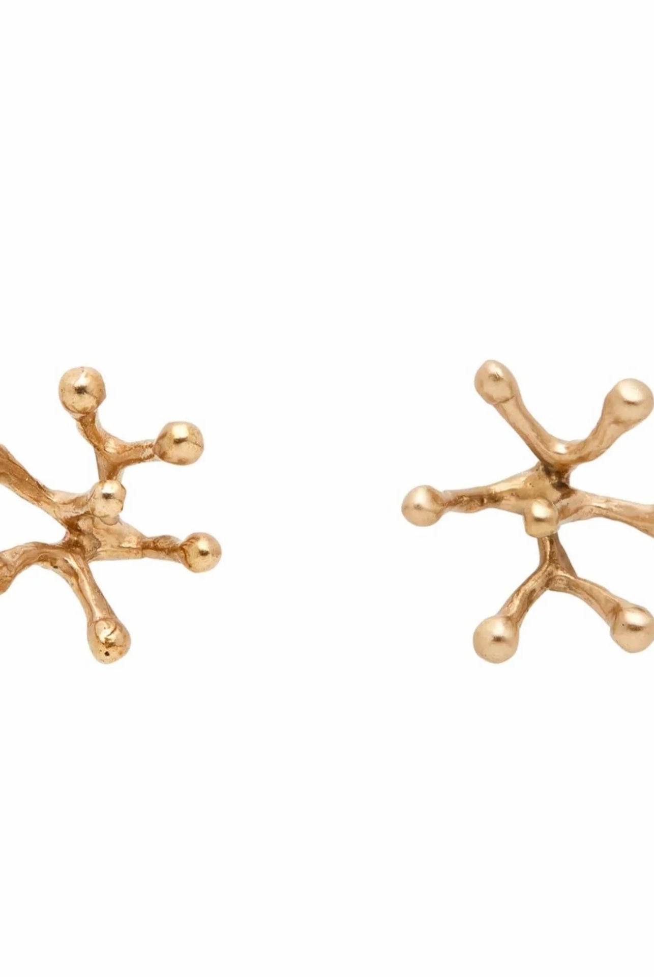 This image displays a pair of bronze Stamen earrings, featuring a unique gold-filled post and a detailed design inspired by natural leaf forms. Each earring is crafted to capture intricate textures and angles, showcasing a blend of bronze and gold tones that highlight their artisanal quality.