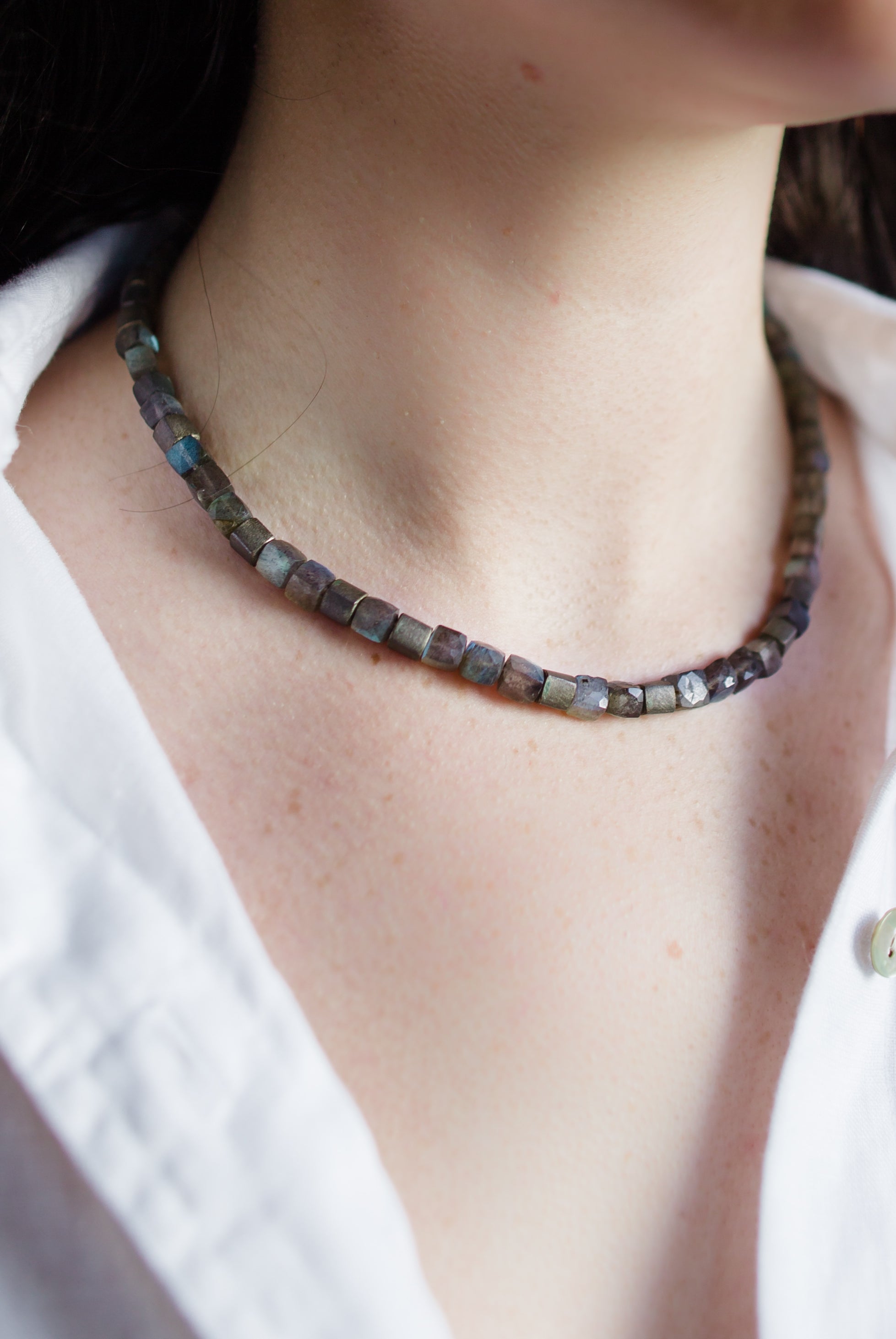 Woman wearing Klaus Spies Grey Moonstone Necklace with handcrafted sterling silver clasp made in USA