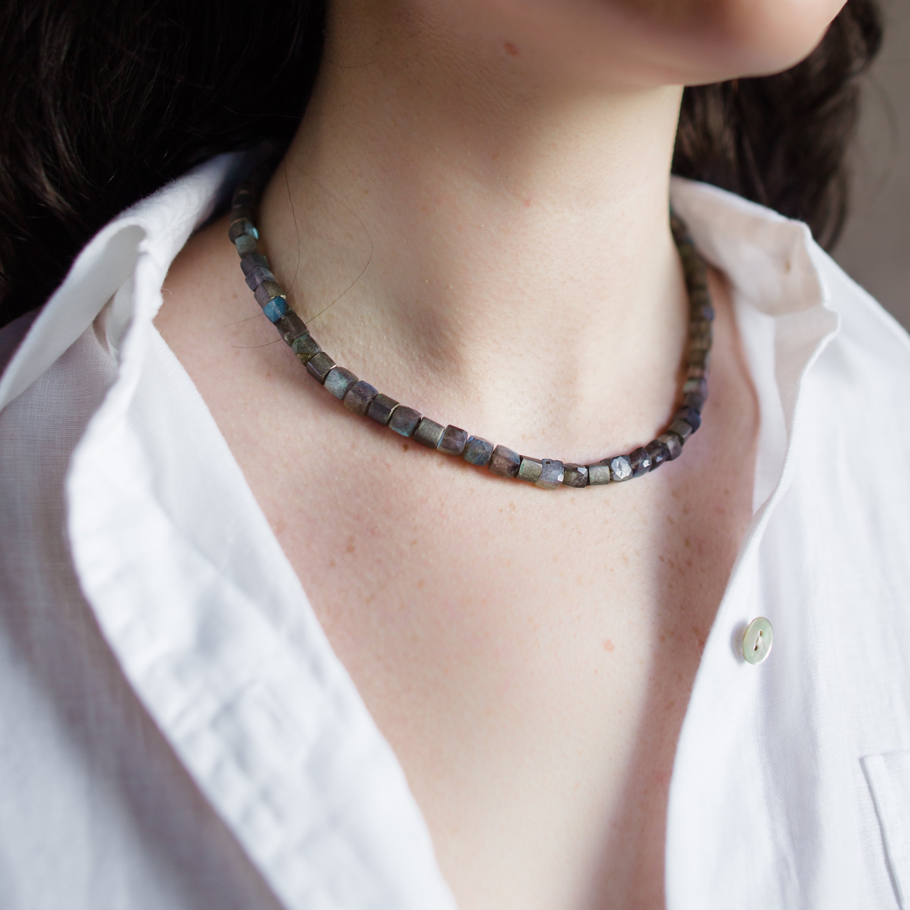 Woman wearing Klaus Spies Grey Moonstone Necklace with handcrafted sterling silver clasp made in USA