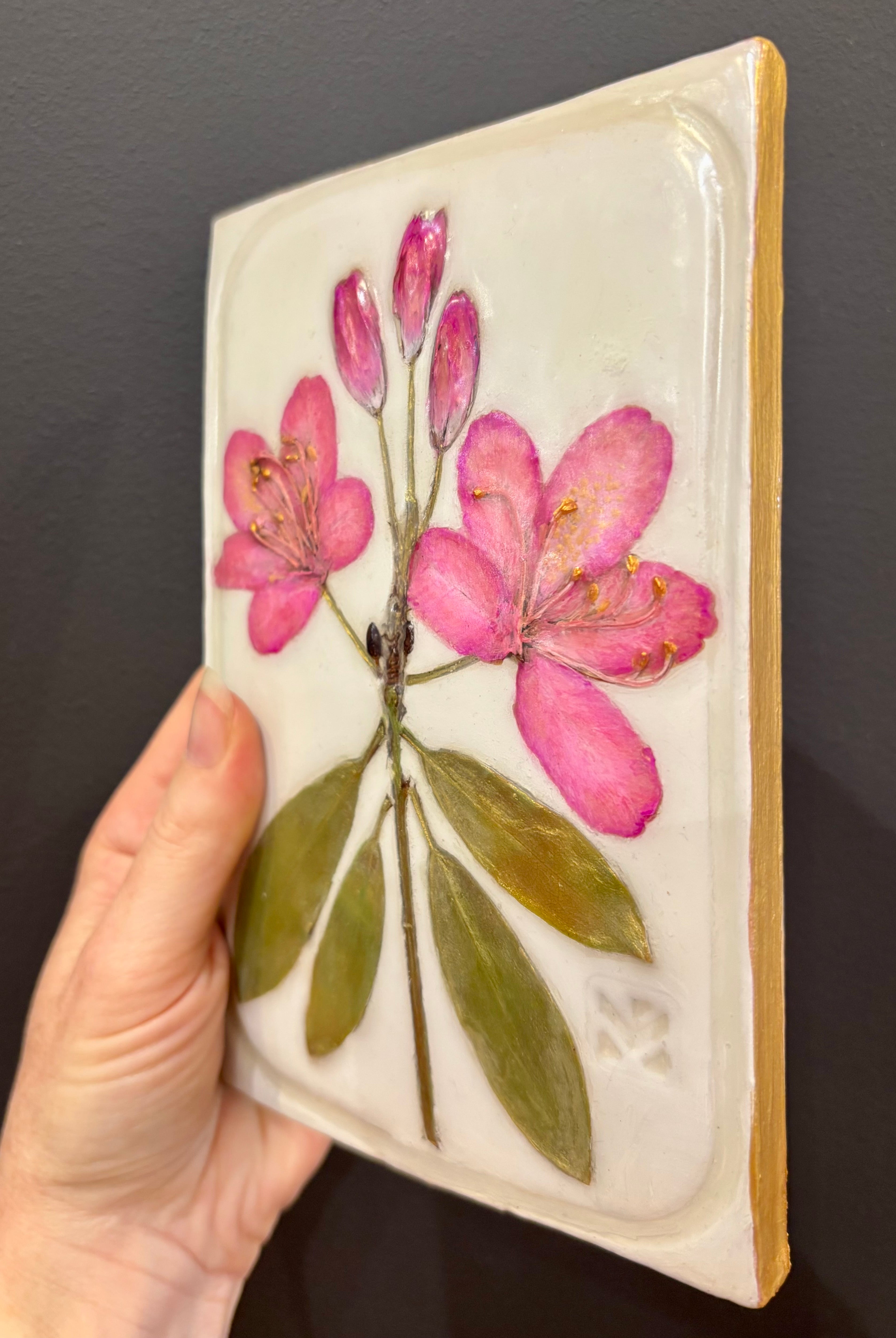 A rectangular ceramic tile with botanical pressed pink rosebay rhododendron on cream clay by local NC artist